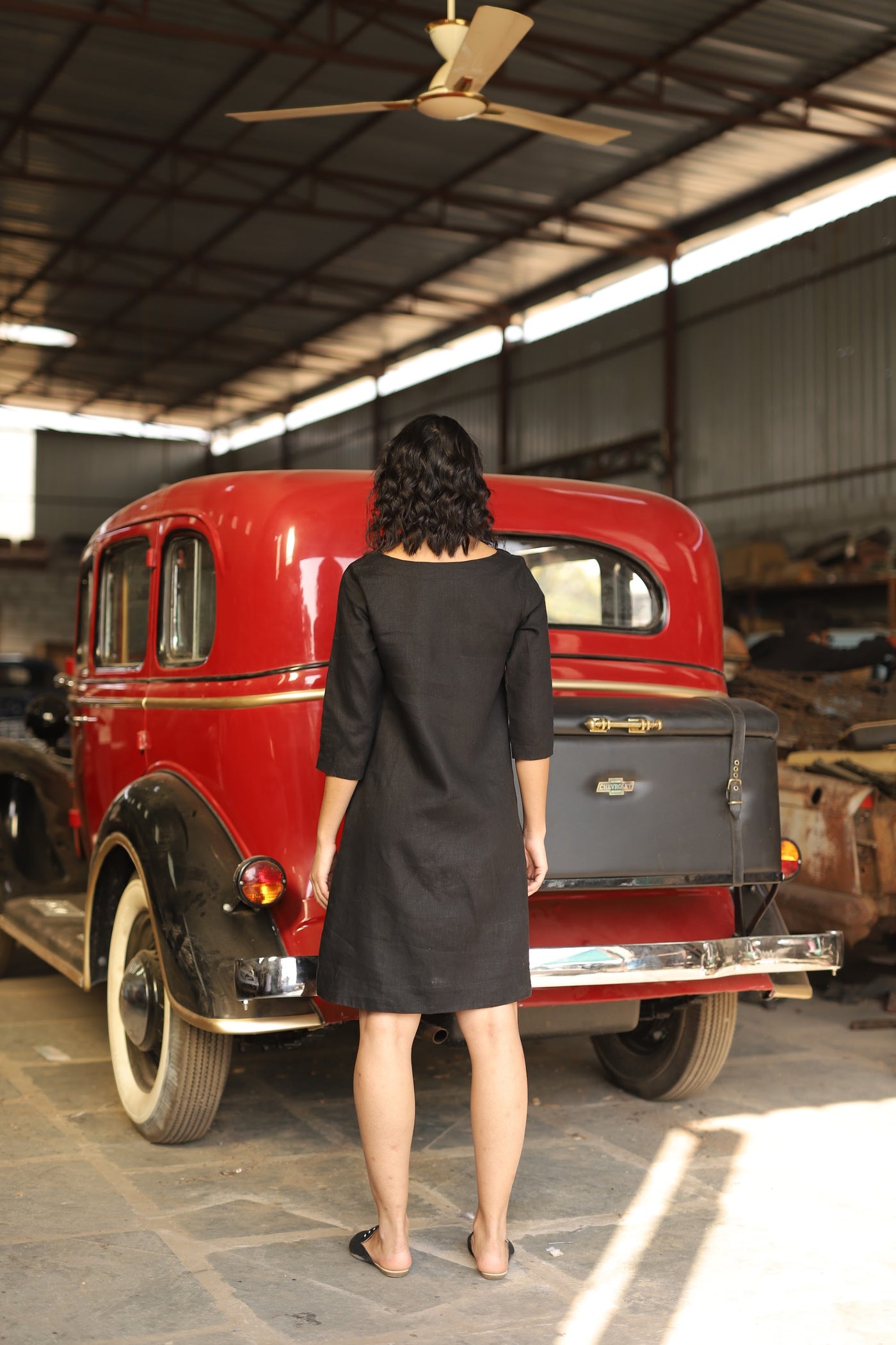 Charcoal sleeveless linen shift dress in washed linen, photographed in Jaipur