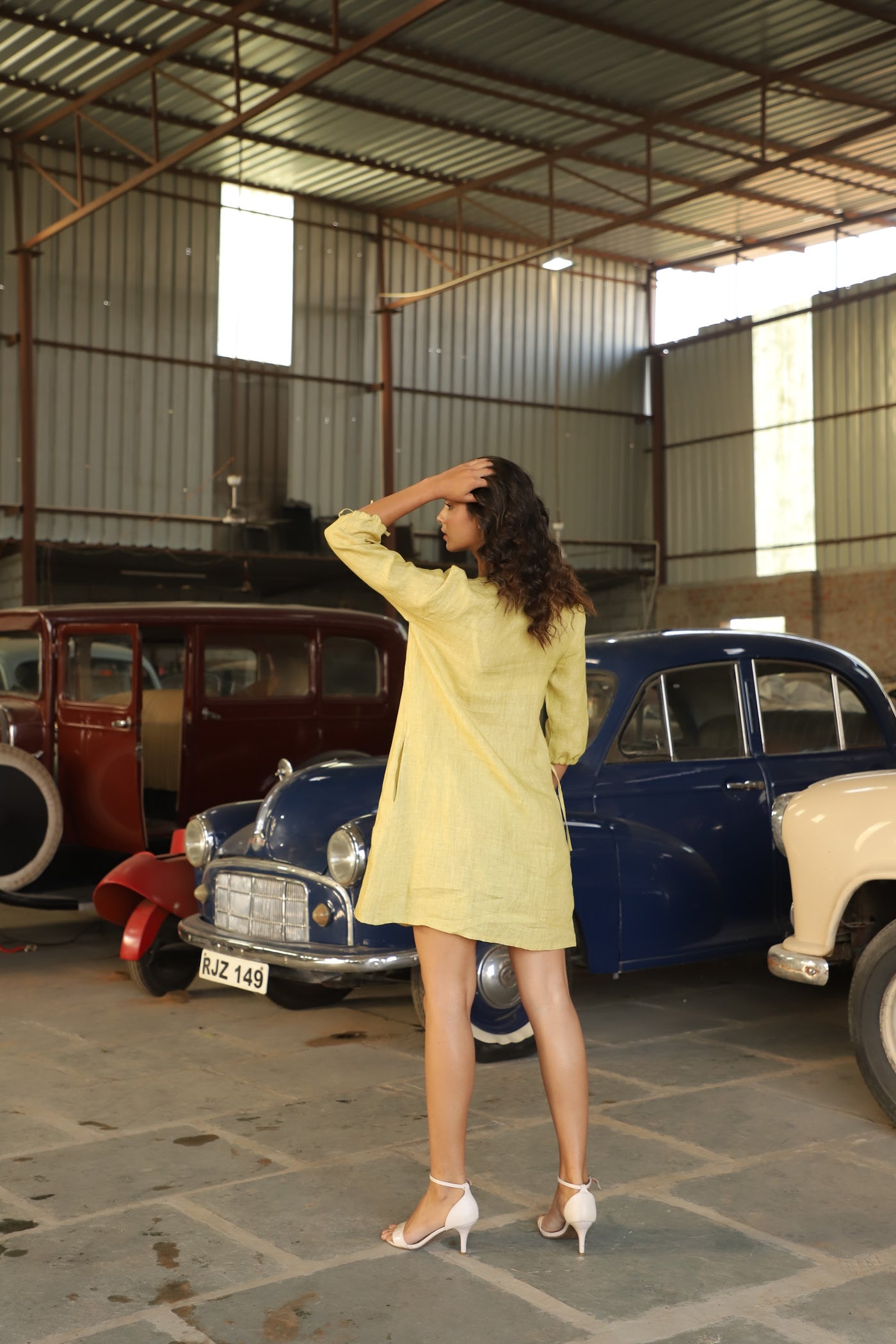 Chartreuse gathered yoke linen dress in washed linen, photographed in Jaipur