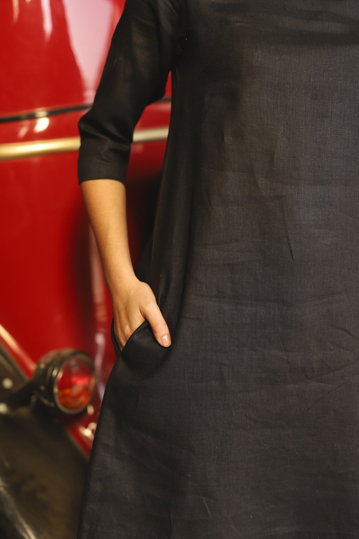 Charcoal sleeveless linen shift dress in washed linen, photographed in Jaipur