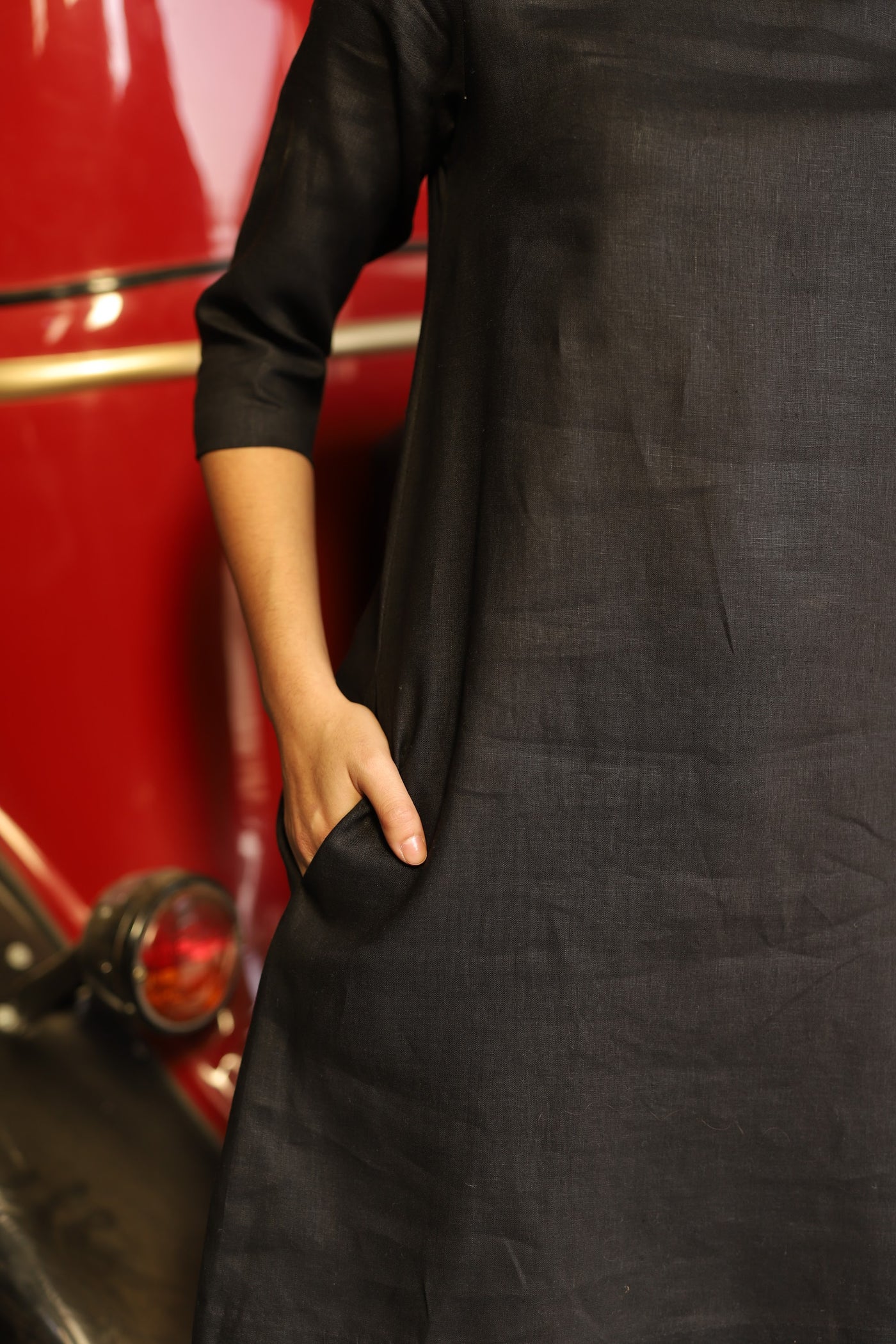 Charcoal sleeveless linen shift dress in washed linen, photographed in Jaipur