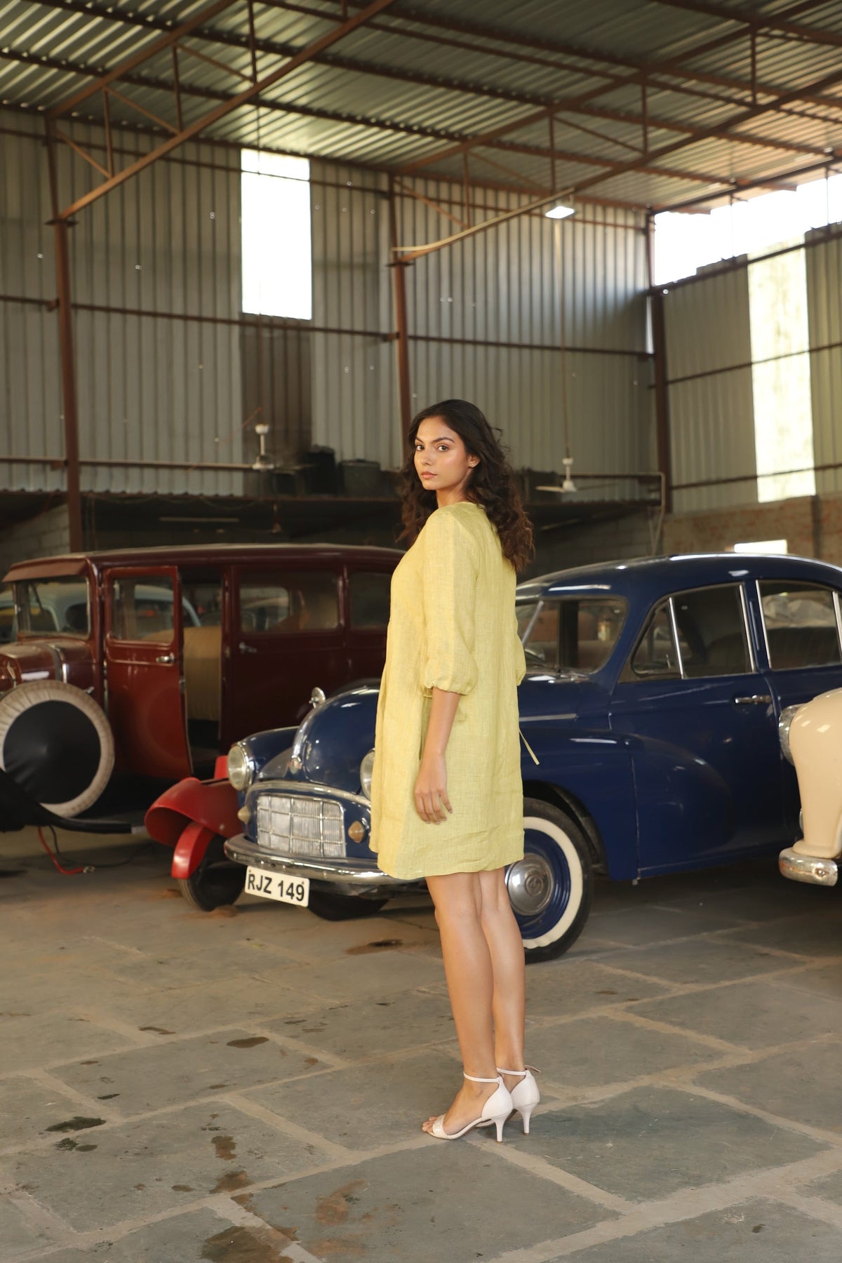 Chartreuse gathered yoke linen dress in washed linen, photographed in Jaipur
