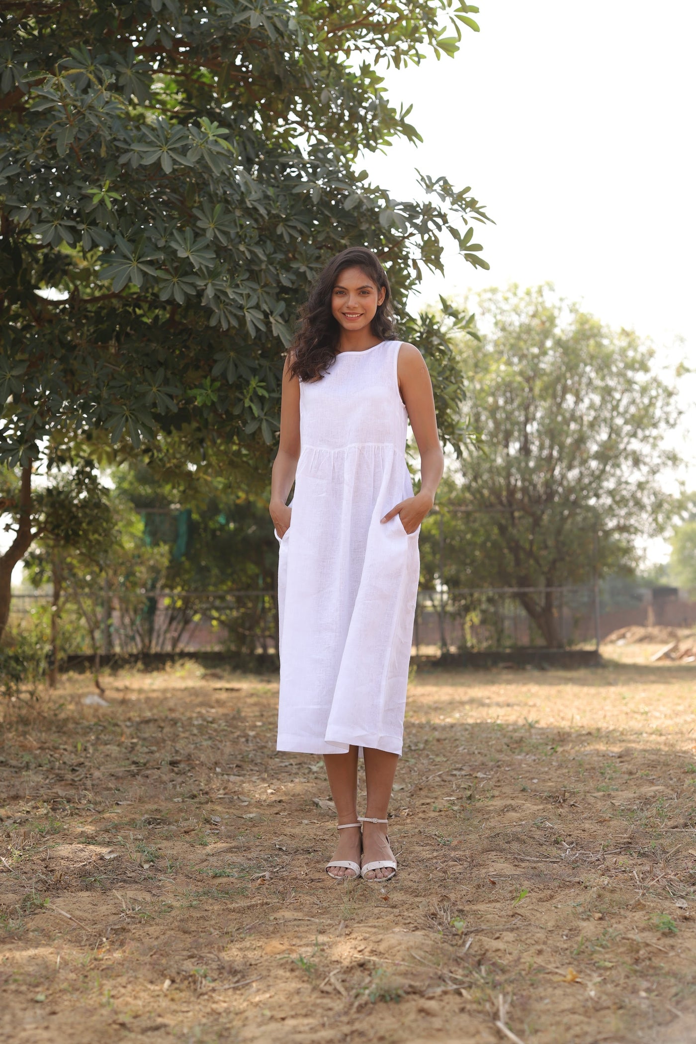 White sleeveless linen midi dress in washed linen, photographed in Jaipur