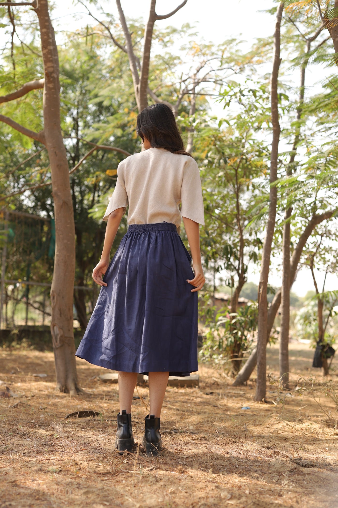 Navy gathered linen midi skirt in washed linen, photographed in Jaipur