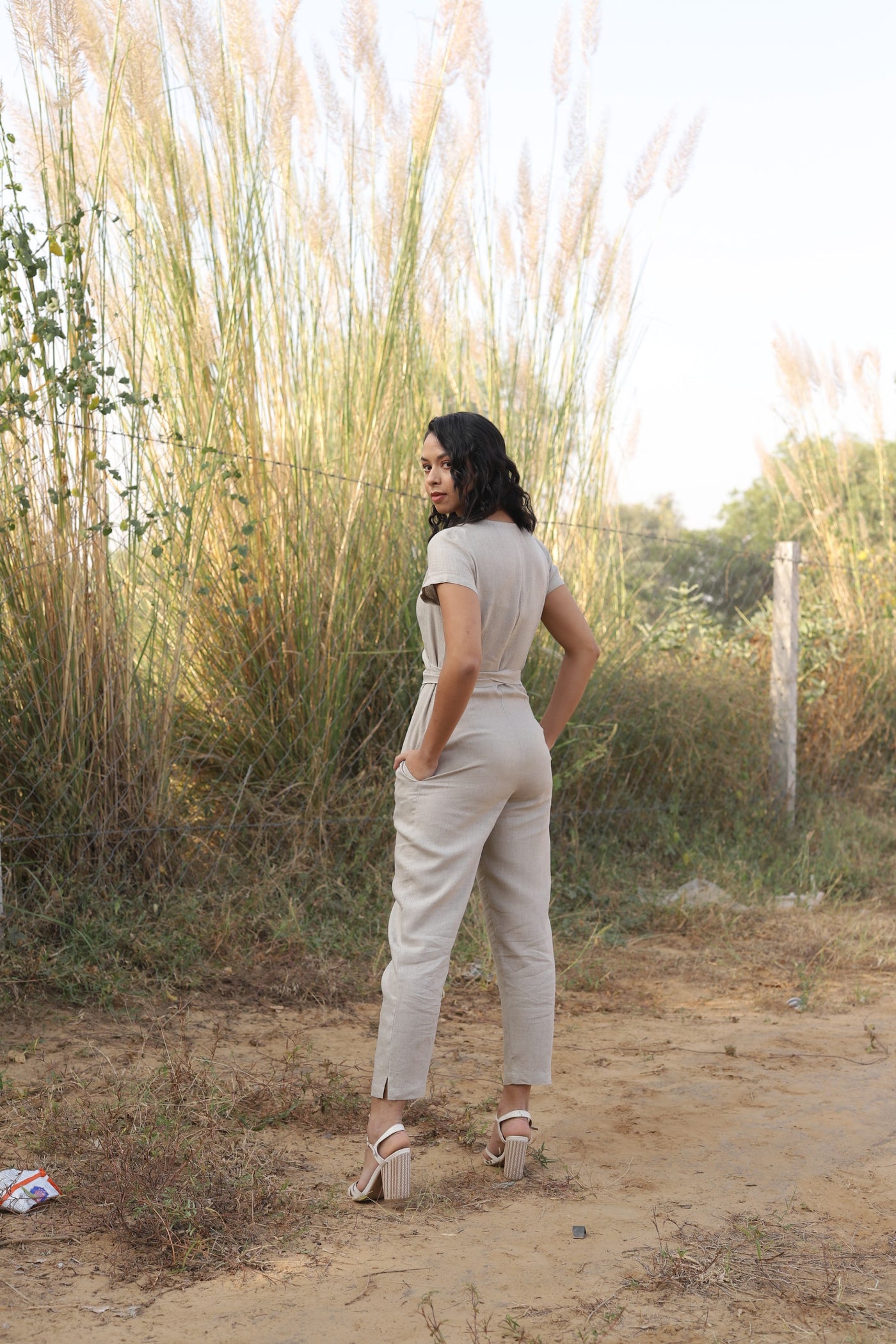 Natural wrap linen jumpsuit in washed linen, photographed in Jaipur