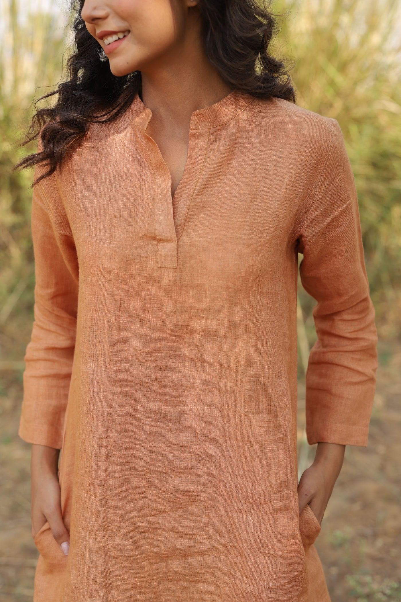 Terracotta long sleeve linen tunic in washed linen, photographed in Jaipur