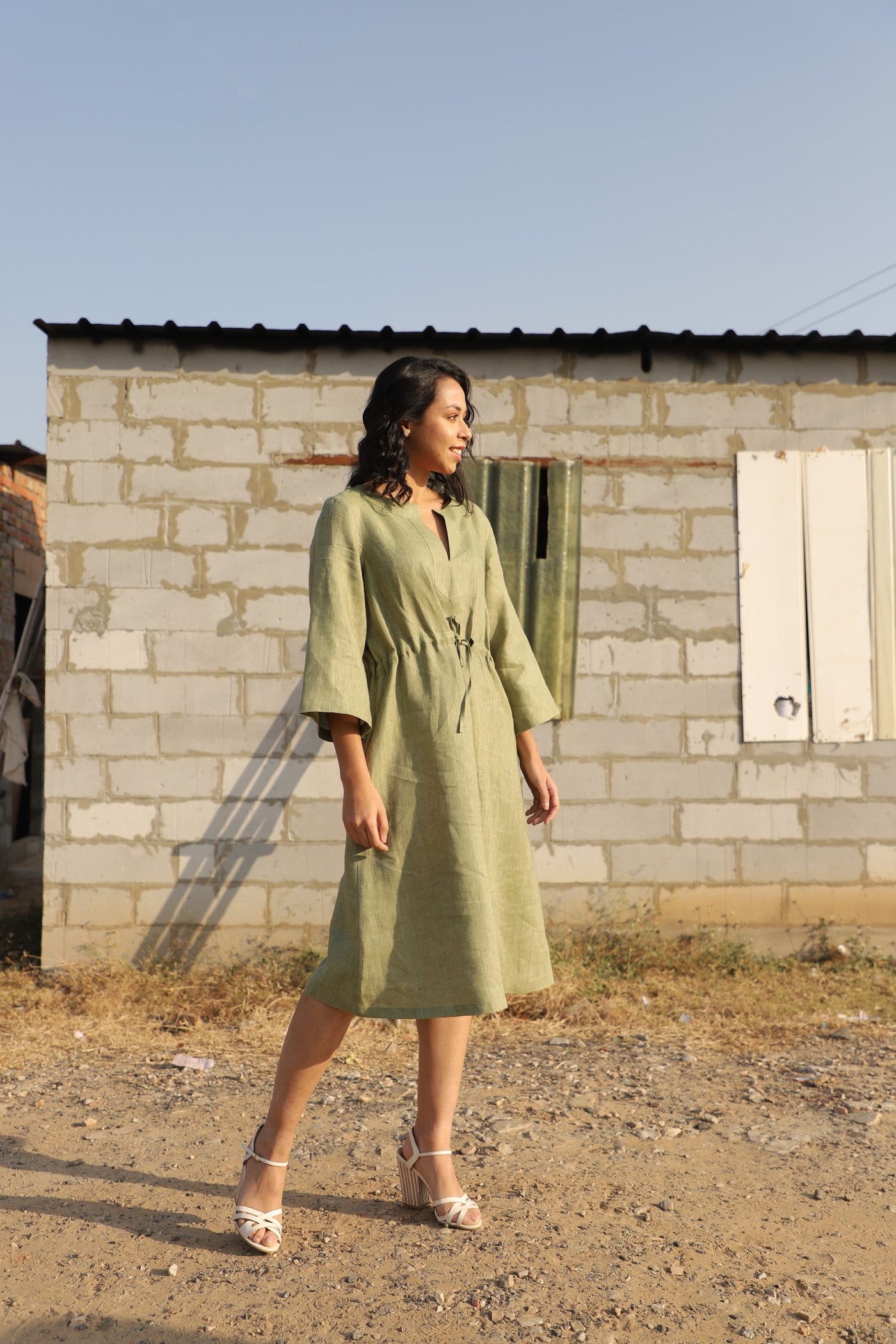 Olive kimono sleeve linen dress in washed linen, photographed in Jaipur