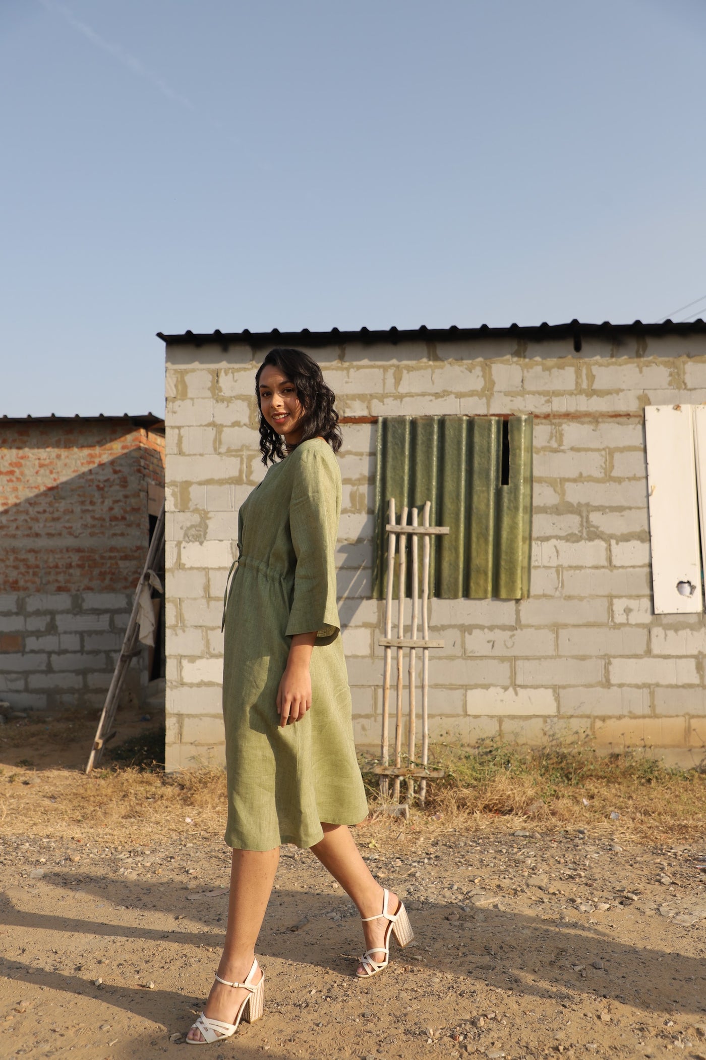 Olive kimono sleeve linen dress in washed linen, photographed in Jaipur