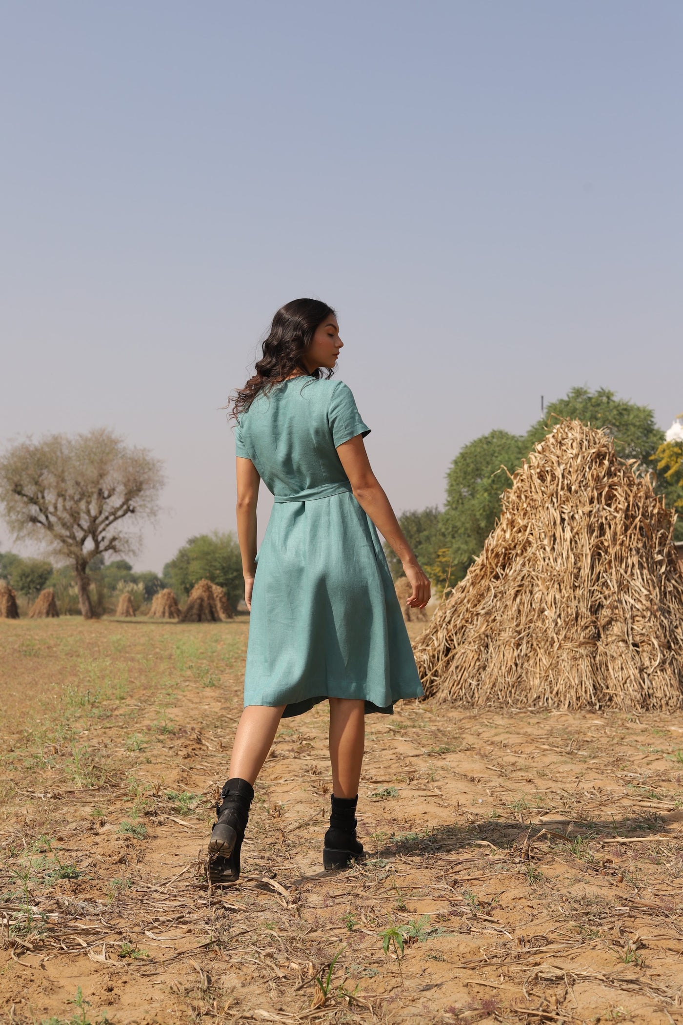 Teal wrap linen midi dress in washed linen, photographed in Jaipur