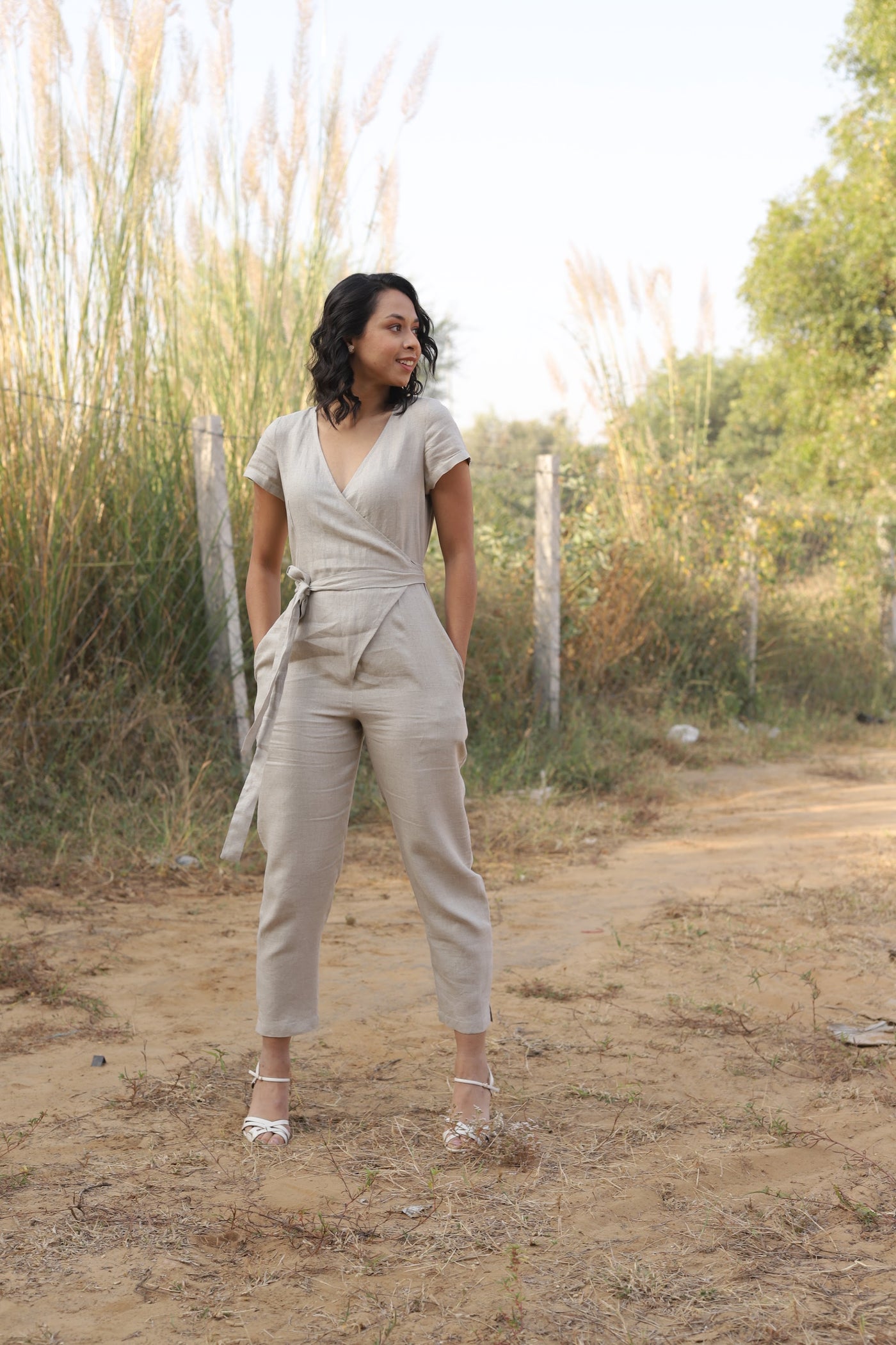 Natural wrap linen jumpsuit in washed linen, photographed in Jaipur