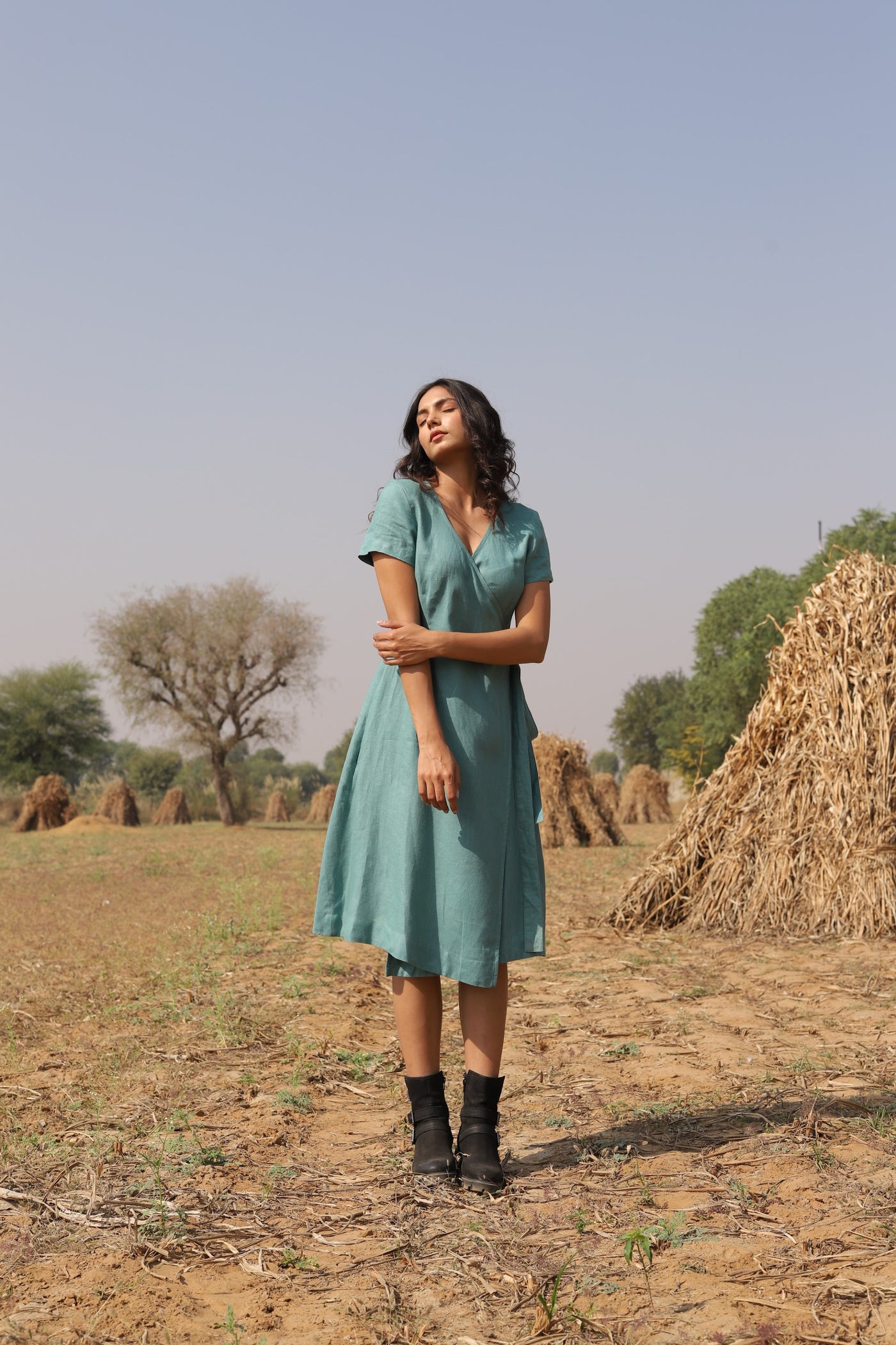 Teal wrap linen midi dress in washed linen, photographed in Jaipur
