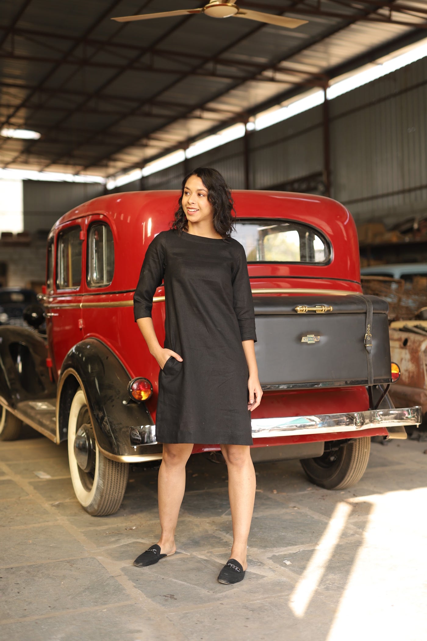 Charcoal sleeveless linen shift dress in washed linen, photographed in Jaipur