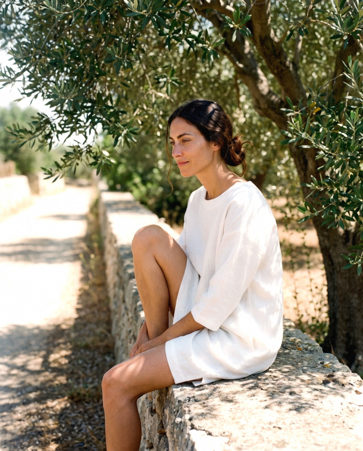 Oversized Linen Shift in white, worn outdoors