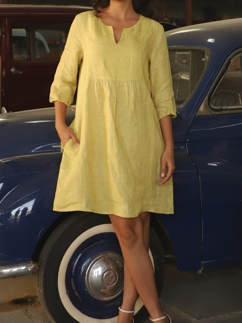 Chartreuse gathered yoke linen dress in washed linen, photographed in Jaipur