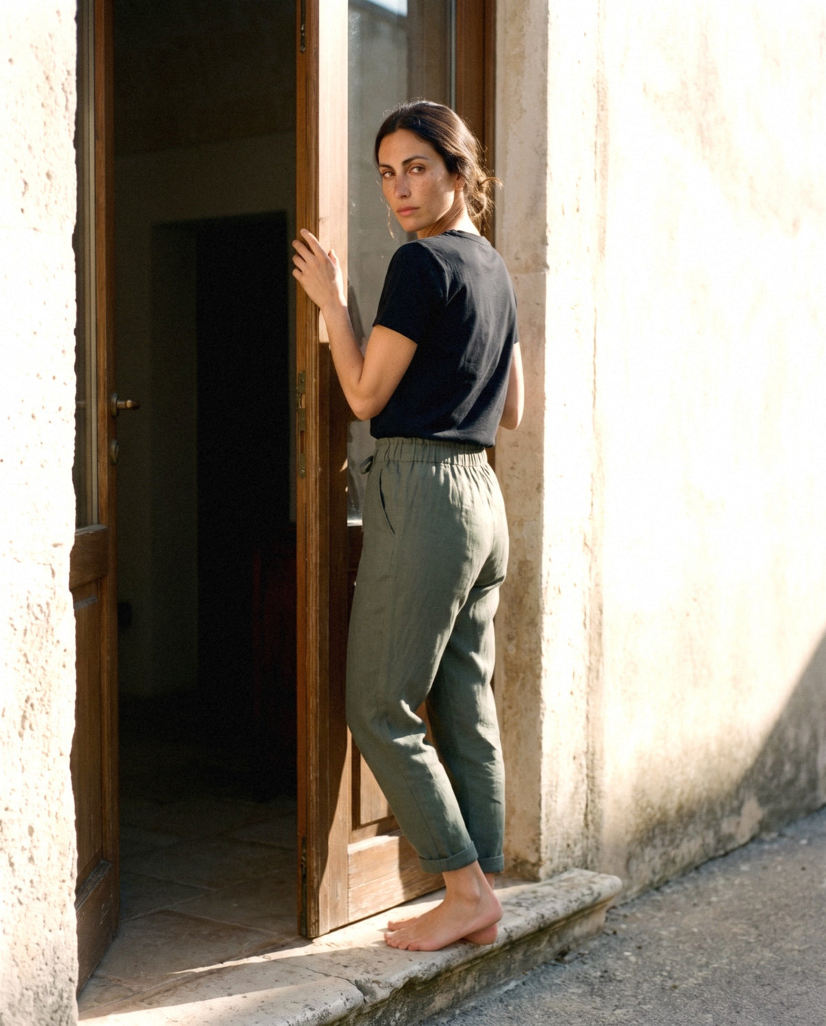 Tapered Linen Trousers in earth colours, worn outdoors