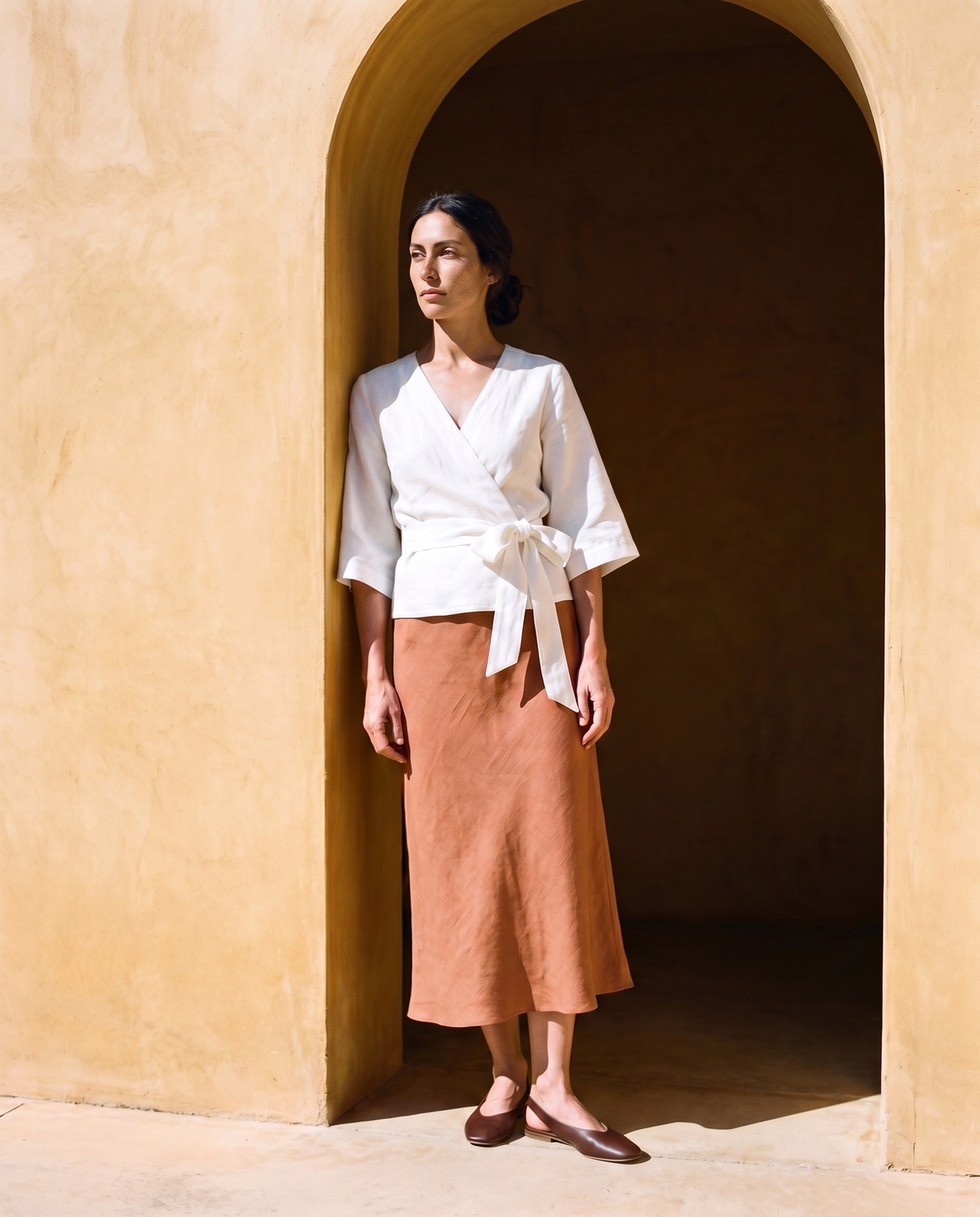 Marta Slip Skirt in clay, styled with the white tie front wrap top