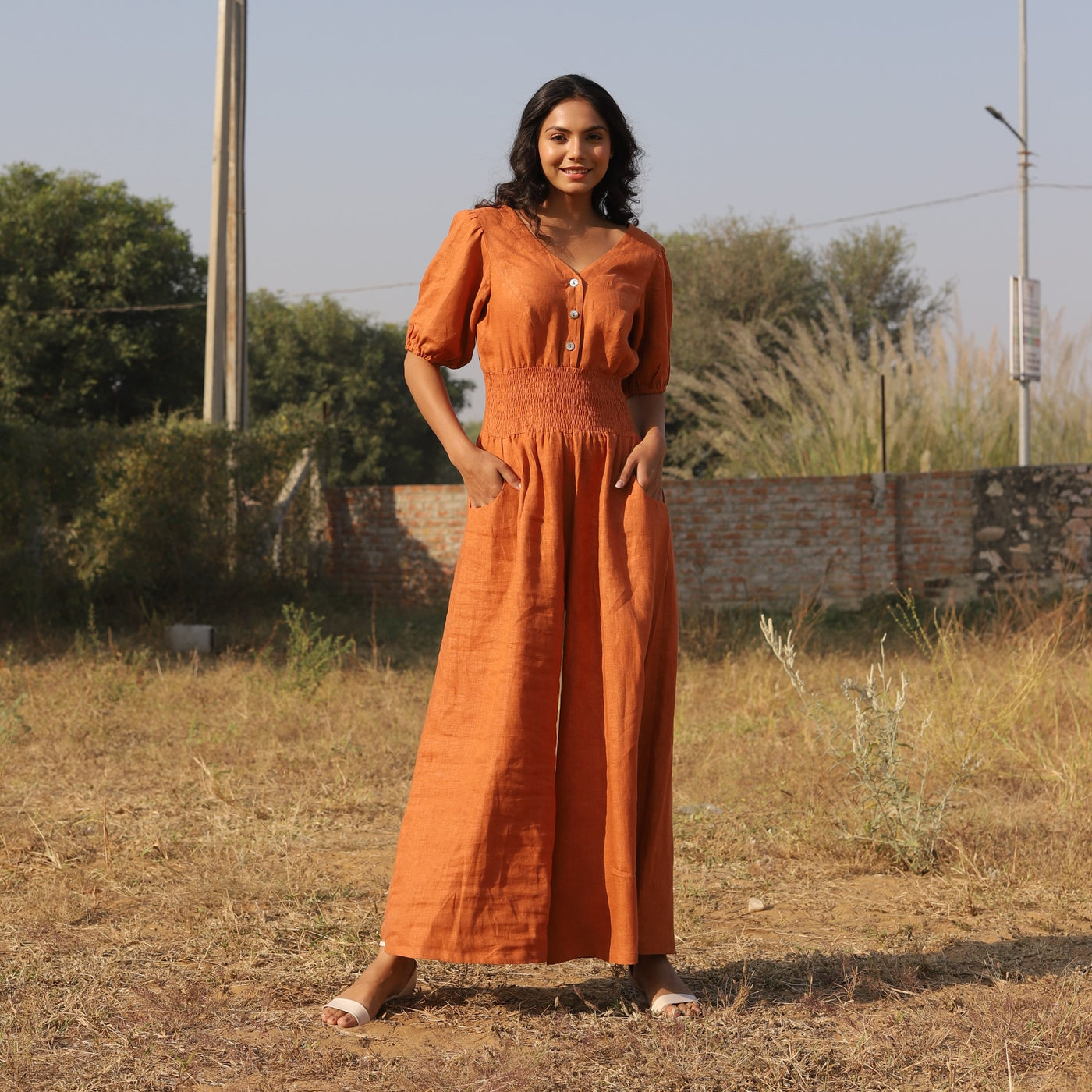 Terracotta button front linen maxi dress in washed linen, photographed in Jaipur