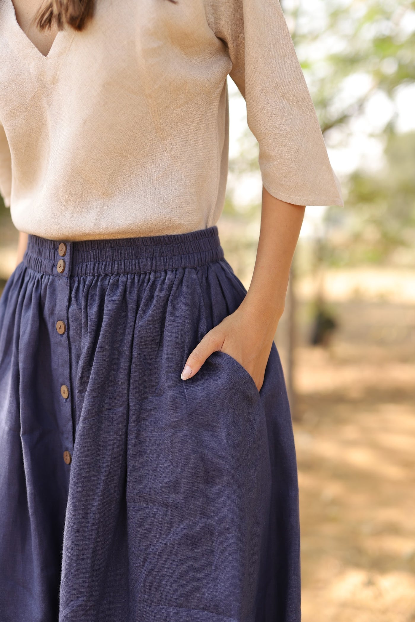 Navy gathered linen midi skirt in washed linen, photographed in Jaipur