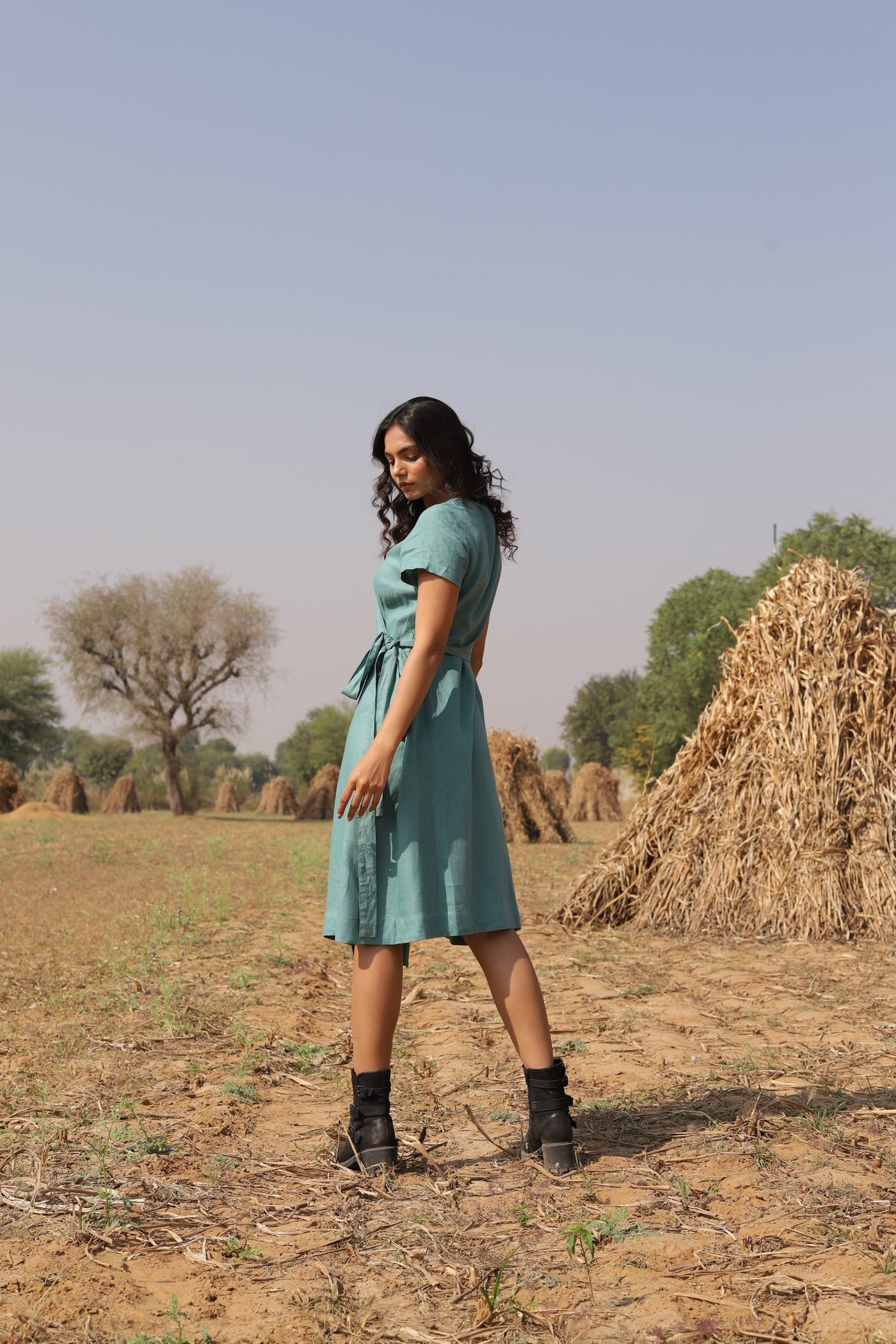 Teal wrap linen midi dress in washed linen, photographed in Jaipur