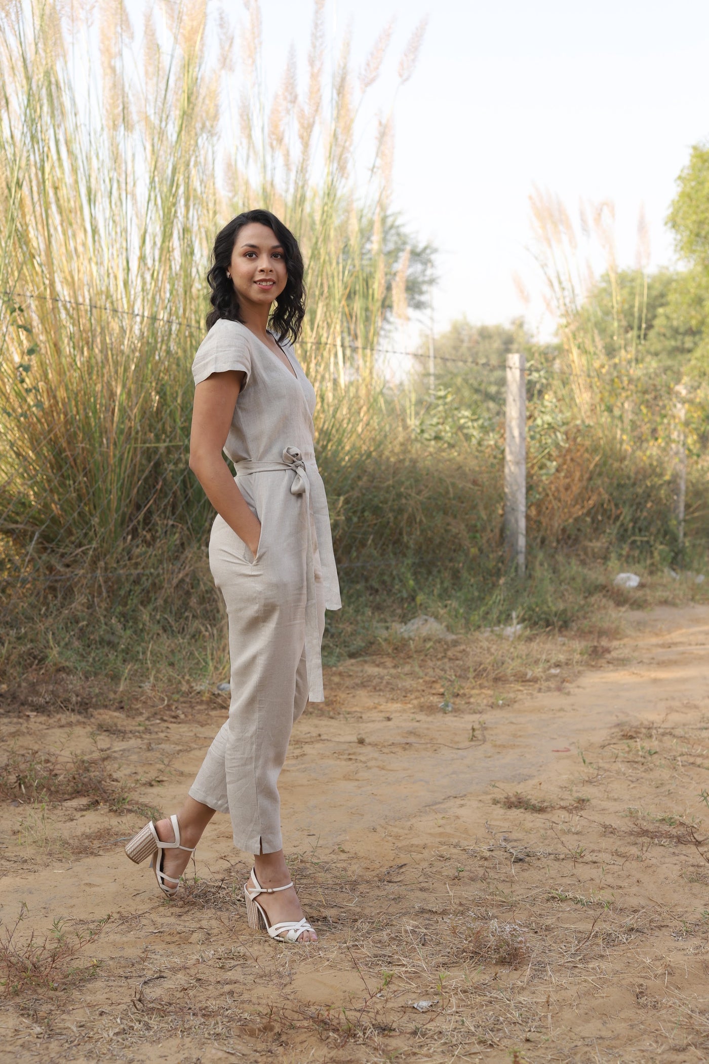 Natural wrap linen jumpsuit in washed linen, photographed in Jaipur