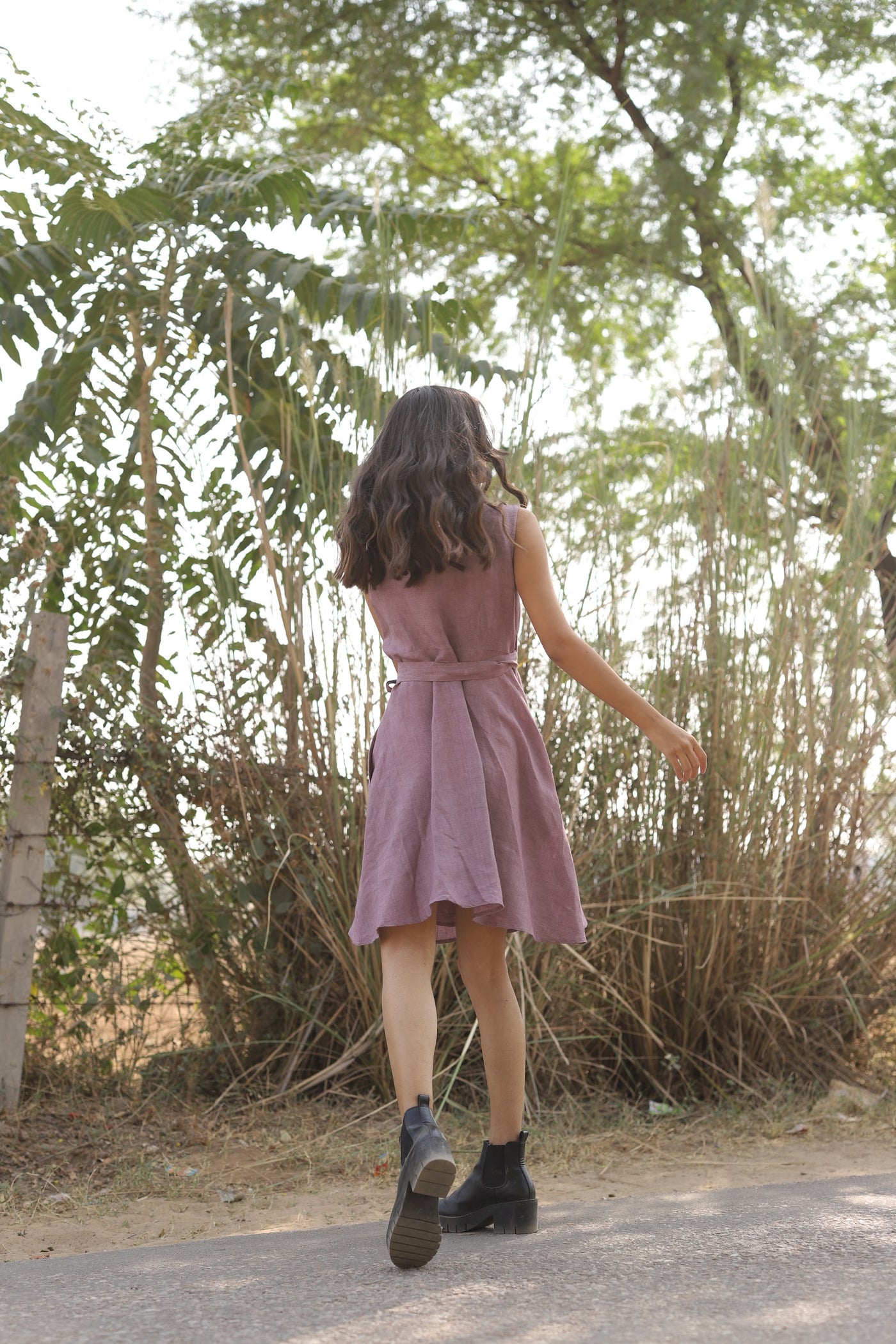 Mauve sleeveless wrap midi dress in washed linen, photographed in Jaipur