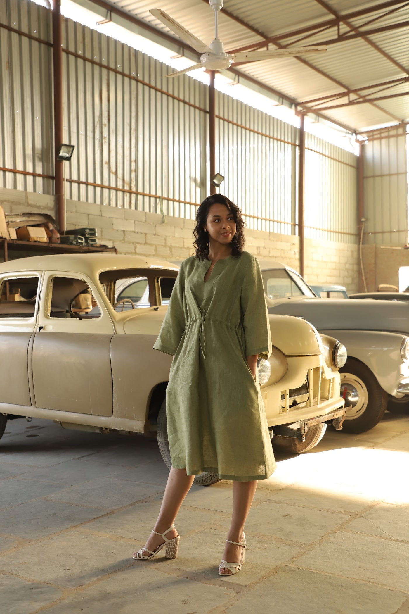 Olive kimono sleeve linen dress in washed linen, photographed in Jaipur