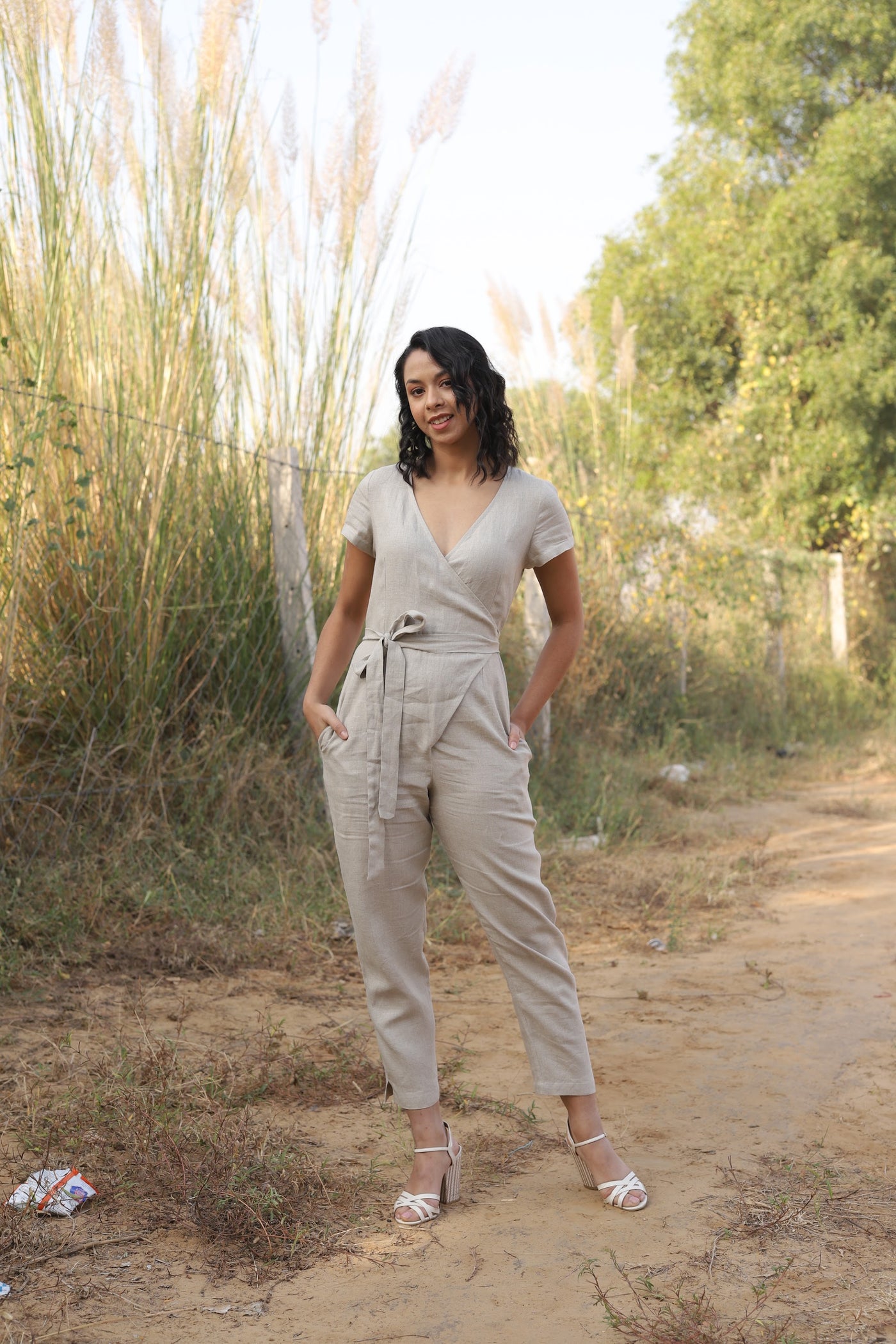 Natural wrap linen jumpsuit in washed linen, photographed in Jaipur