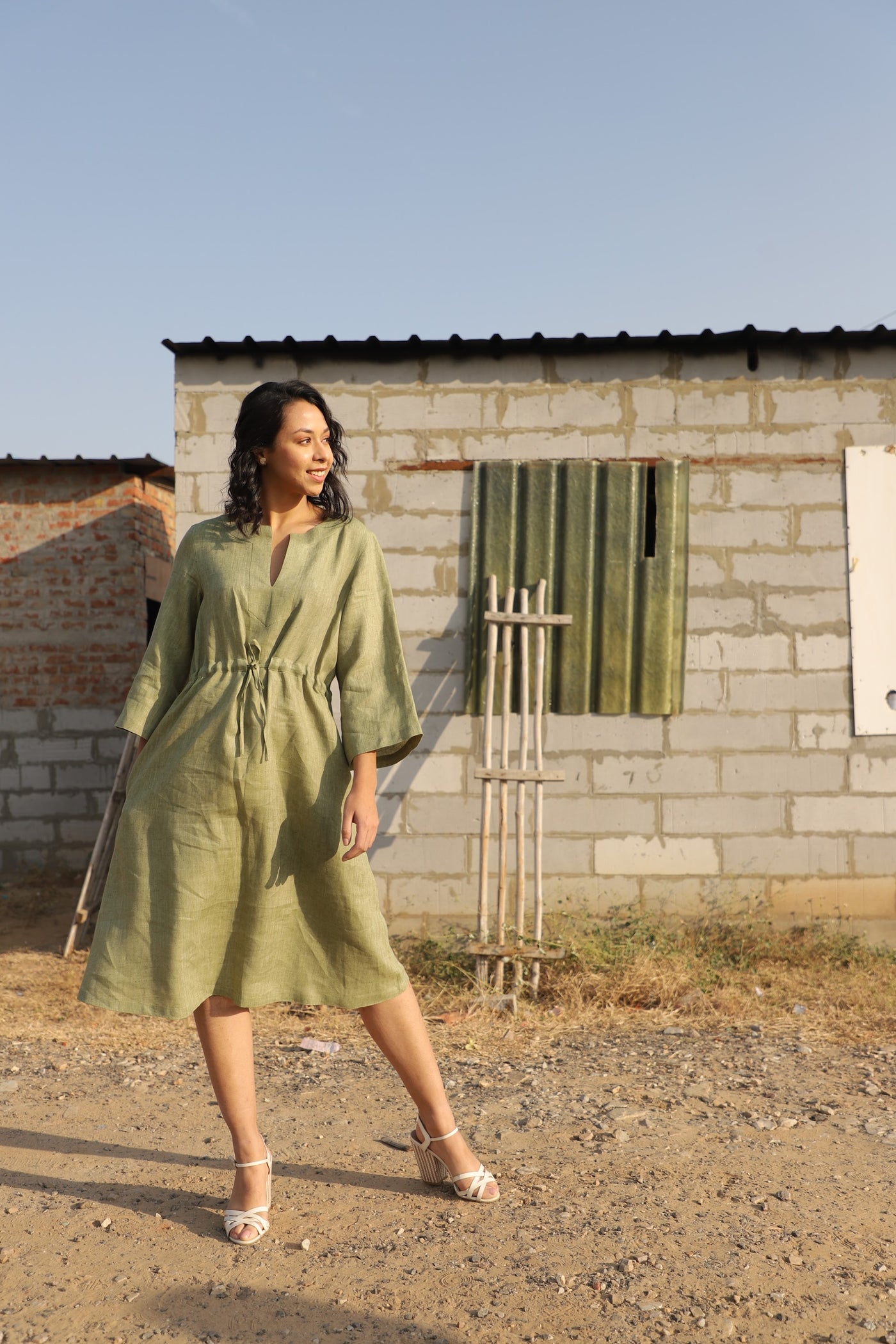 Olive kimono sleeve linen dress in washed linen, photographed in Jaipur