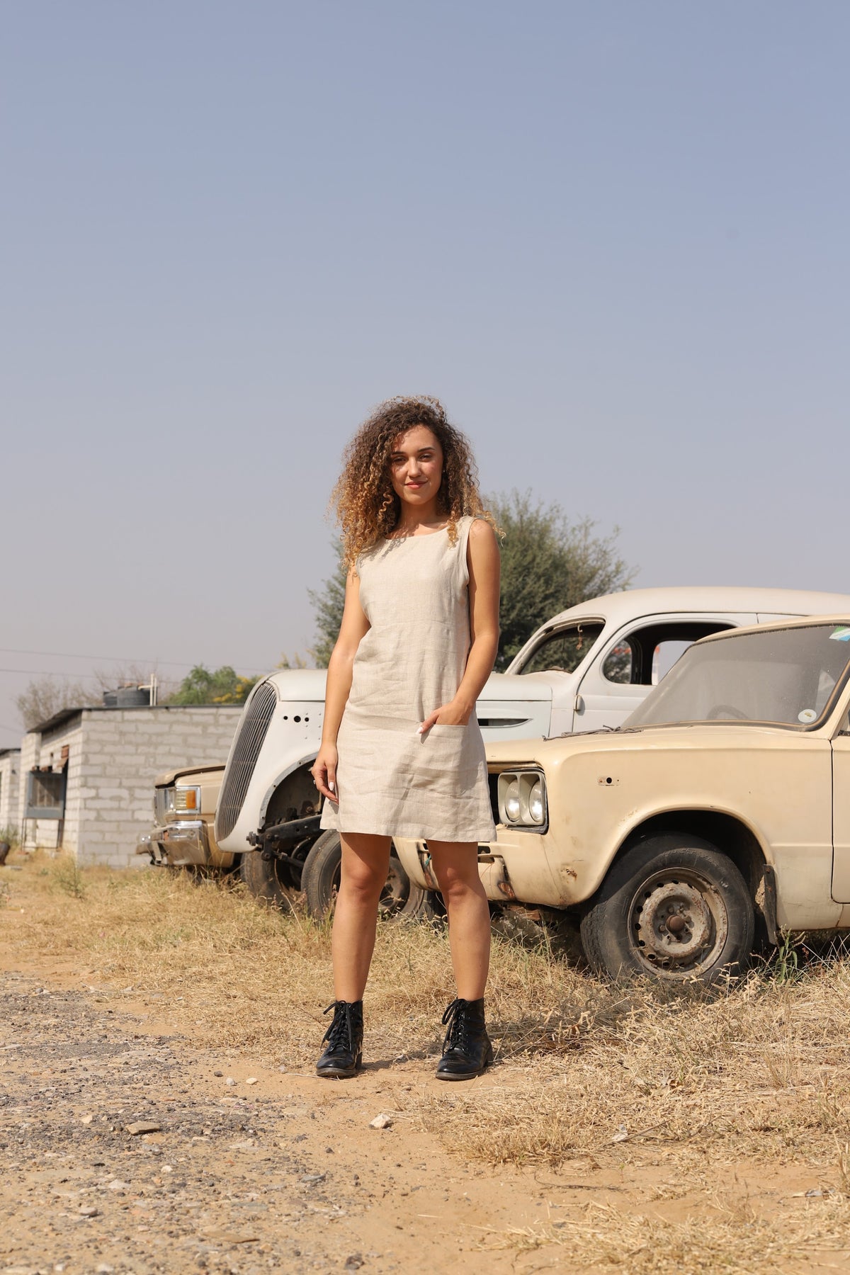 Natural sleeveless linen shift in washed linen, photographed in Jaipur