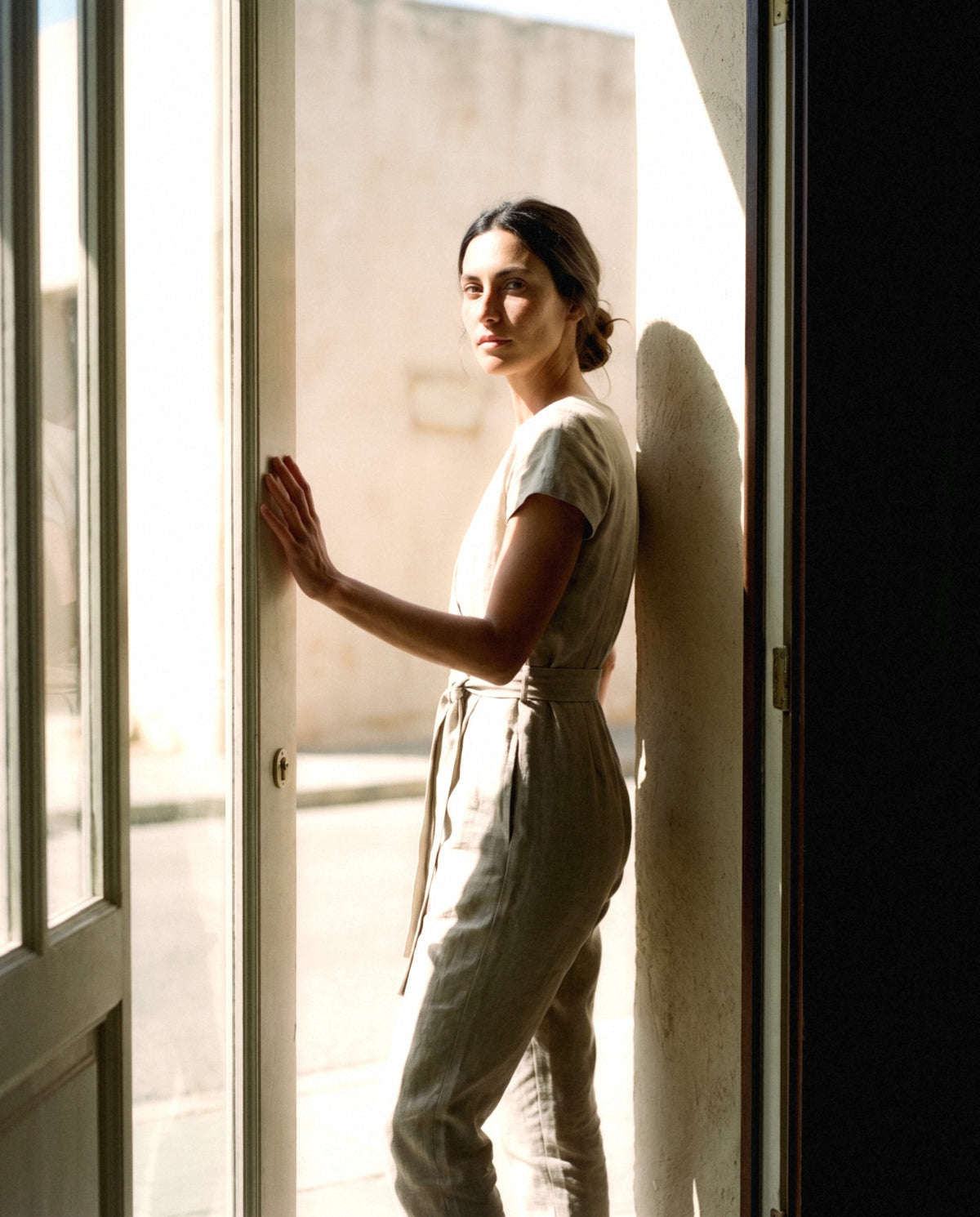 Wrap Linen Jumpsuit in natural, worn outdoors