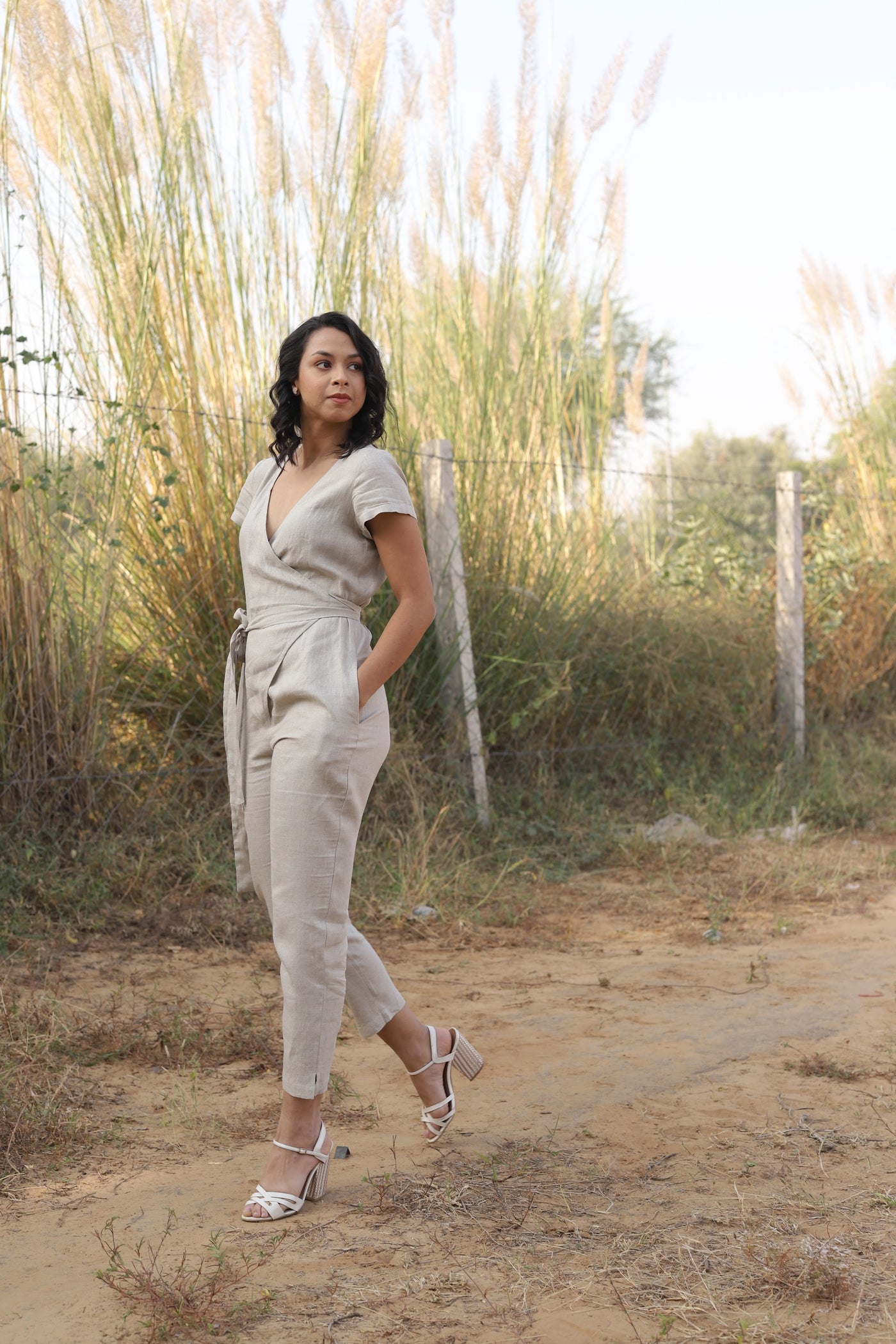 Natural wrap linen jumpsuit in washed linen, photographed in Jaipur