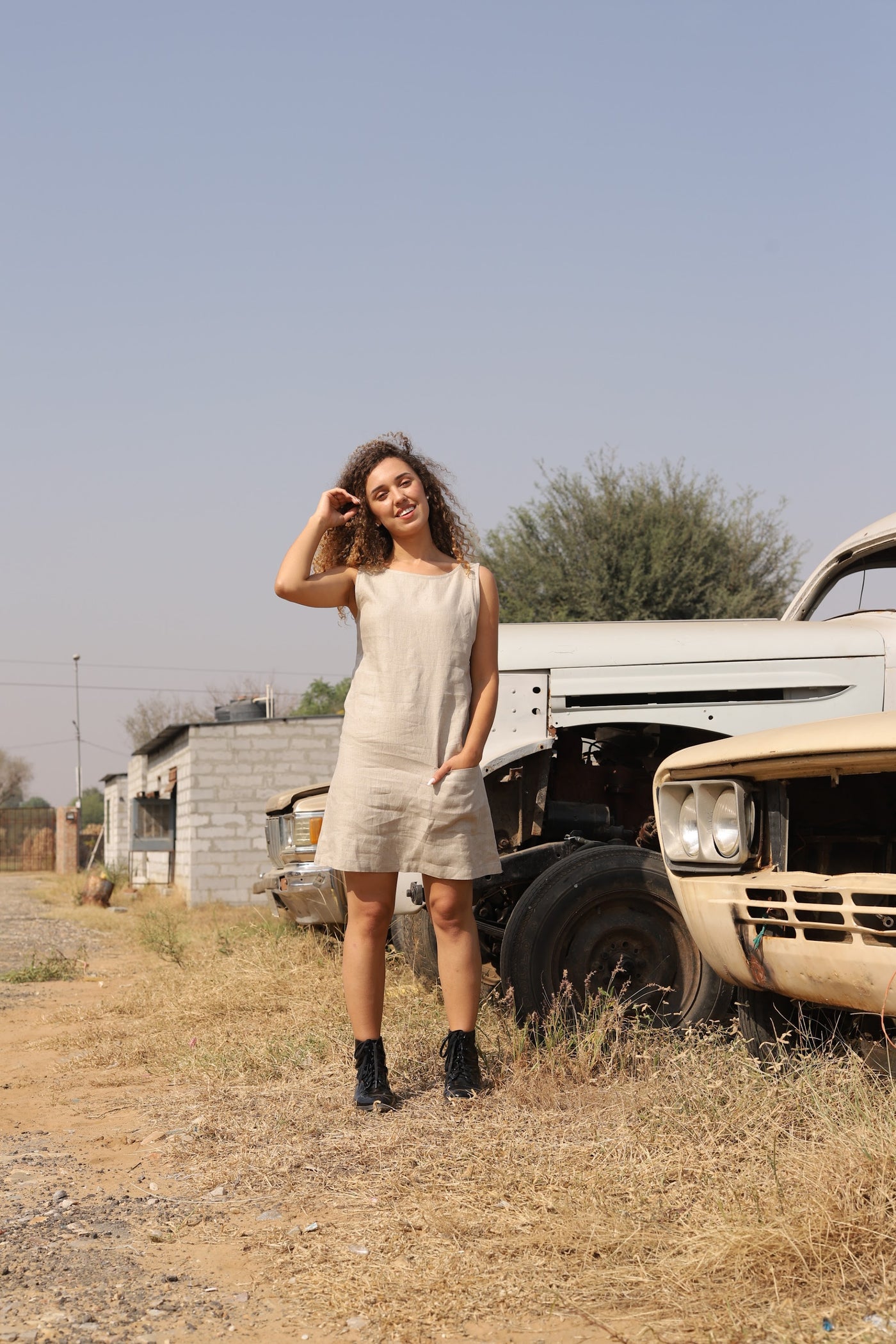 Natural sleeveless linen shift in washed linen, photographed in Jaipur