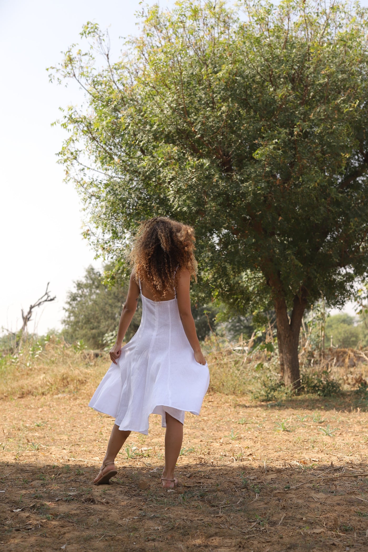 White strappy linen sundress in washed linen, photographed in Jaipur