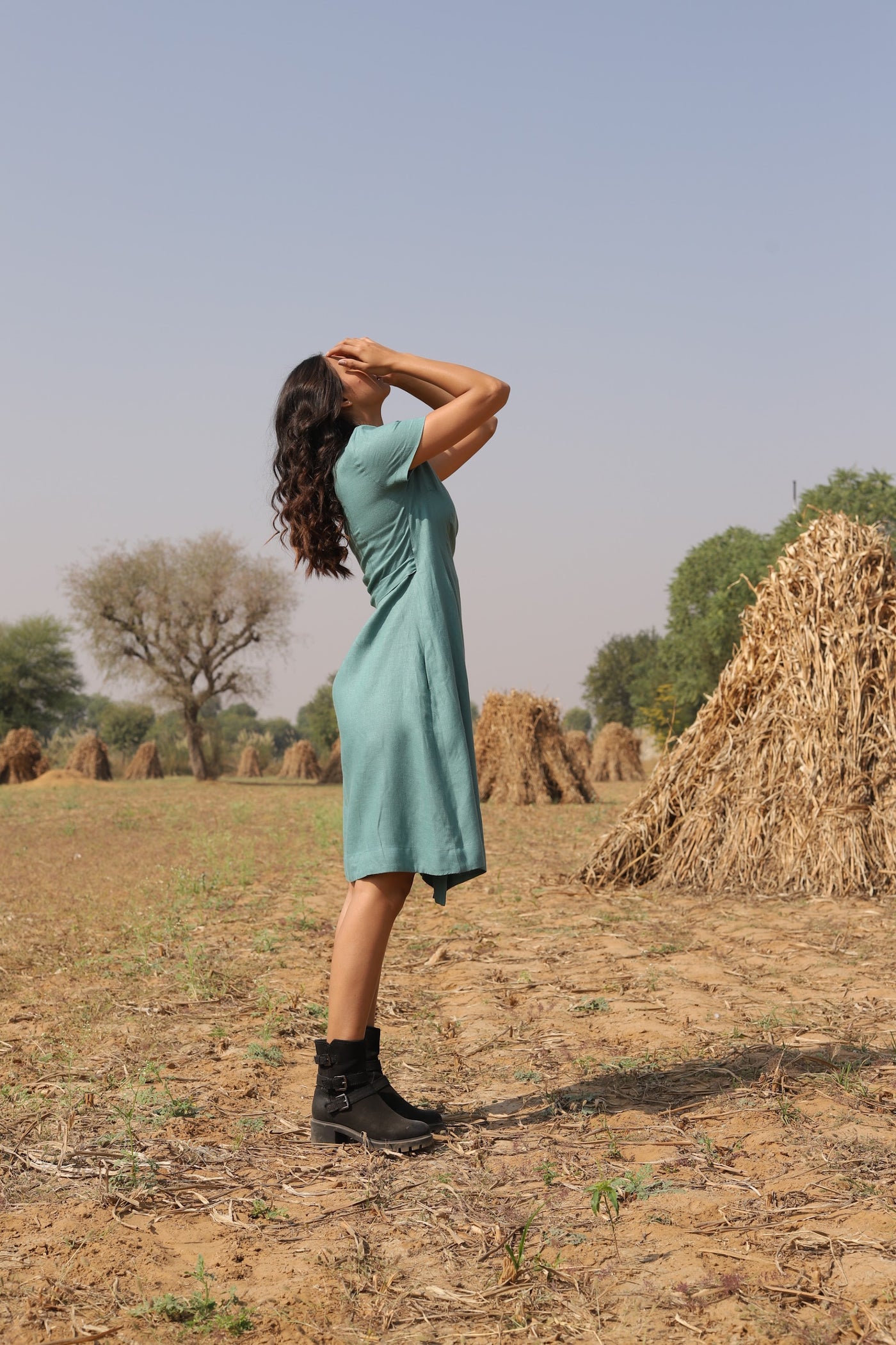 Teal wrap linen midi dress in washed linen, photographed in Jaipur