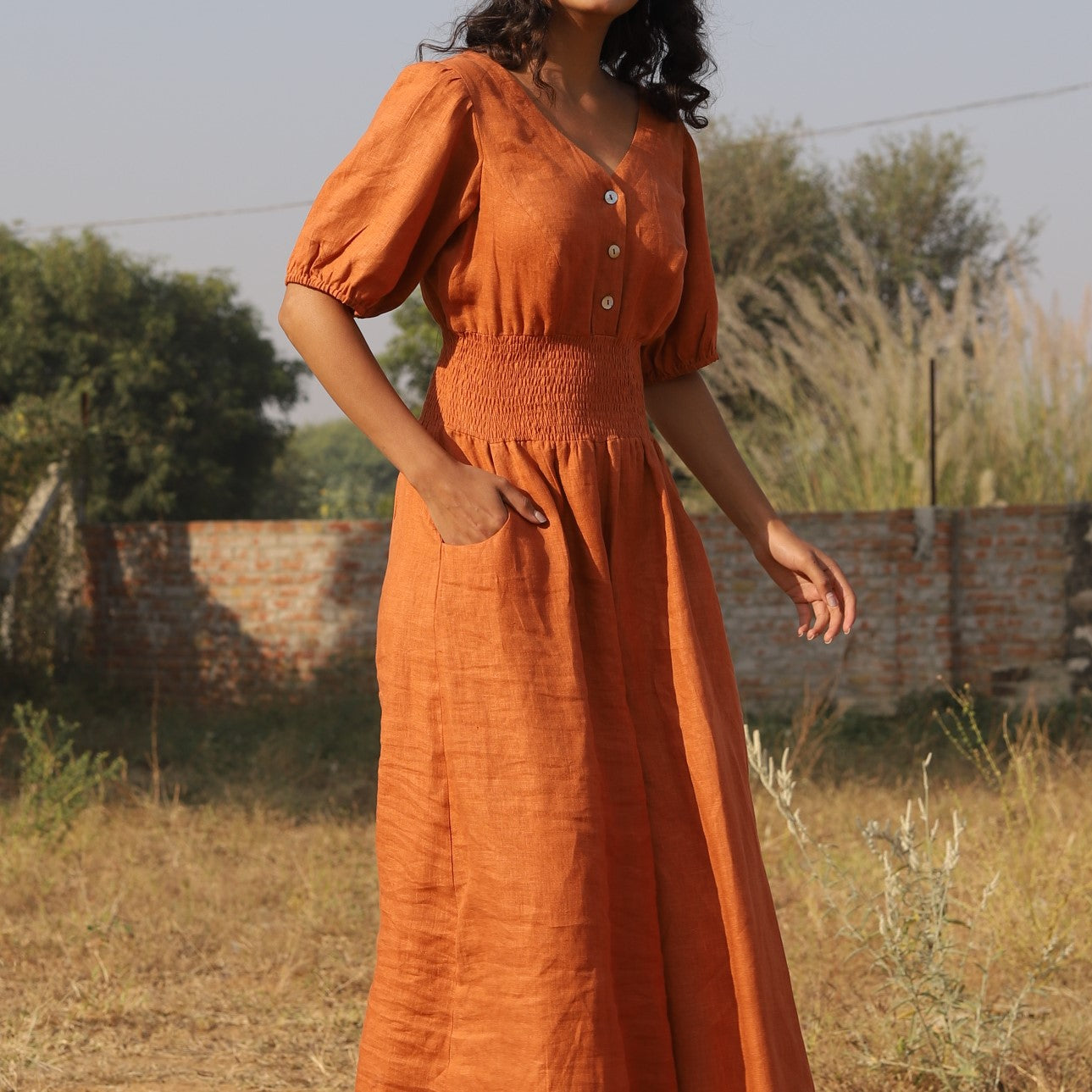 Terracotta button front linen maxi dress in washed linen, photographed in Jaipur