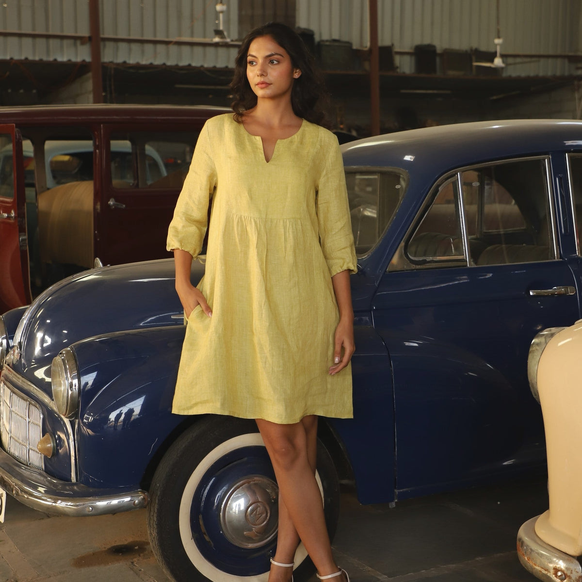Chartreuse gathered yoke linen dress in washed linen, photographed in Jaipur