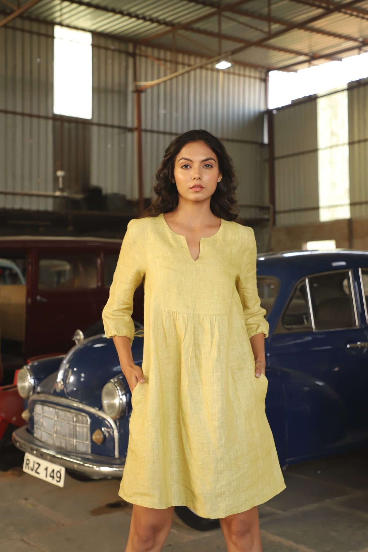 Chartreuse gathered yoke linen dress in washed linen, photographed in Jaipur