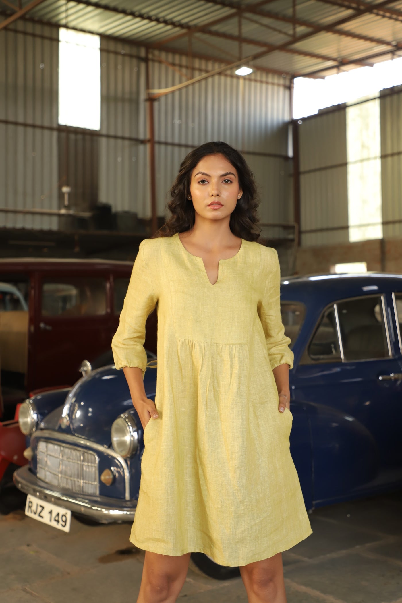 Chartreuse gathered yoke linen dress in washed linen, photographed in Jaipur