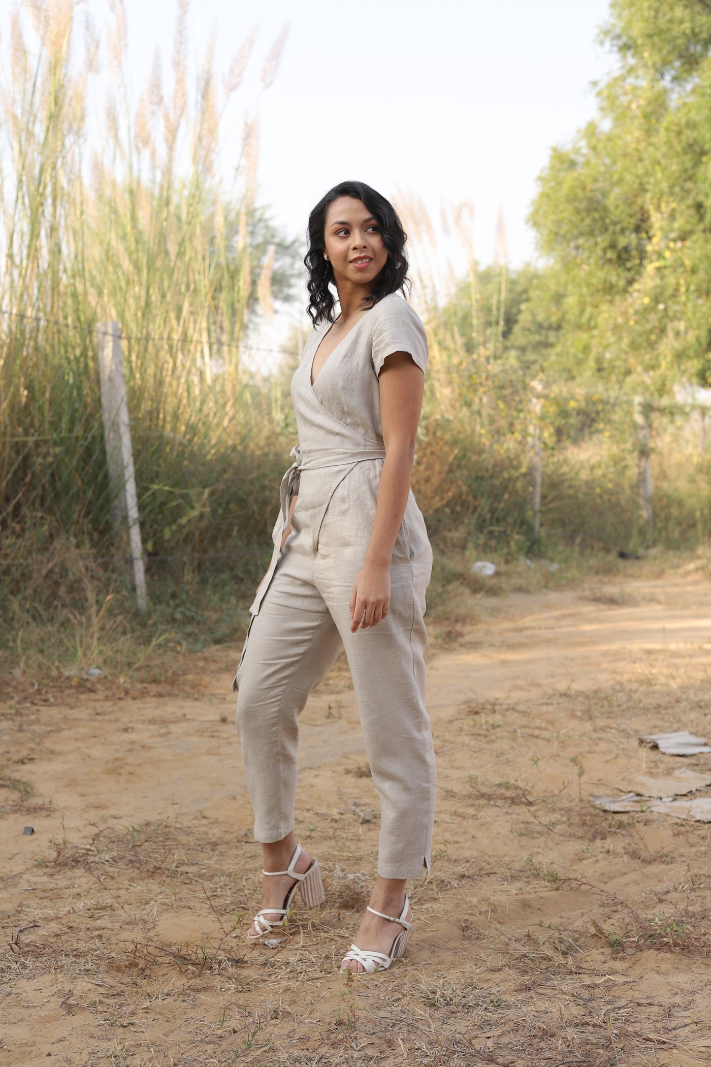 Natural wrap linen jumpsuit in washed linen, photographed in Jaipur