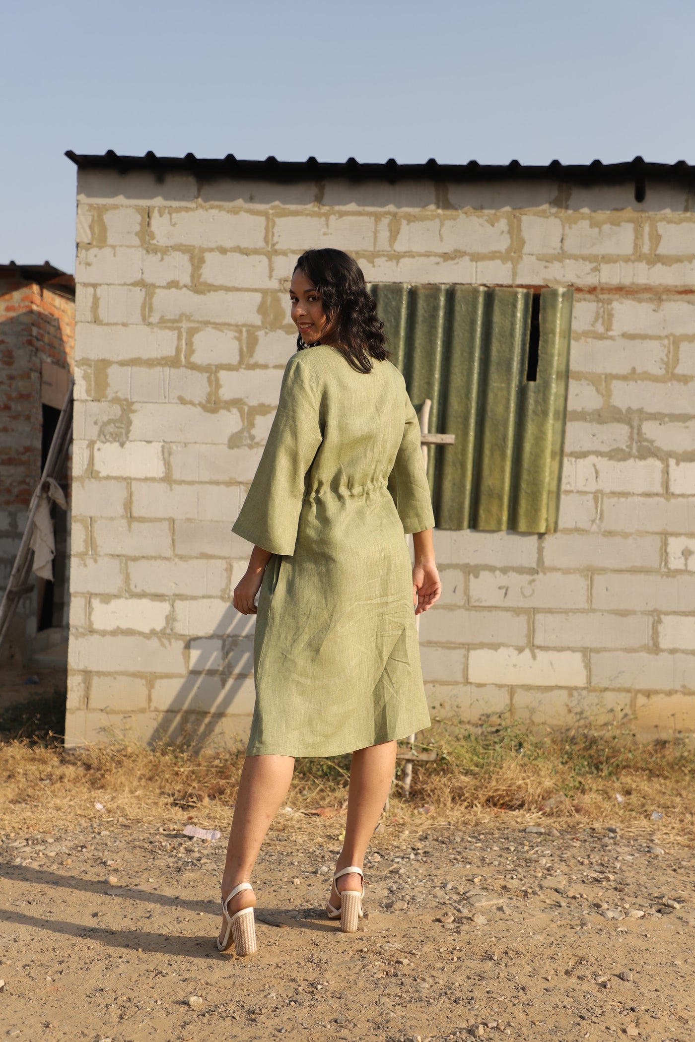 Olive kimono sleeve linen dress in washed linen, photographed in Jaipur