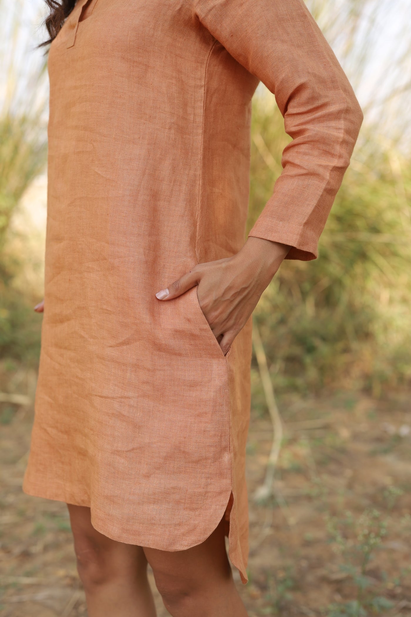 Terracotta long sleeve linen tunic in washed linen, photographed in Jaipur