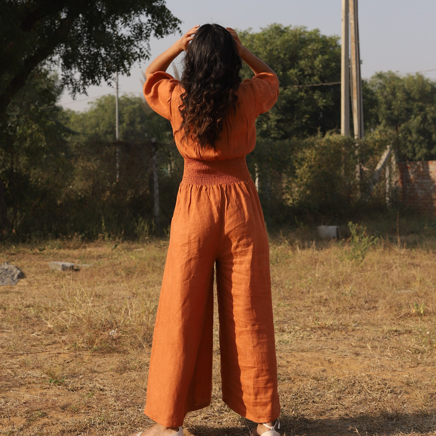 Terracotta button front linen maxi dress in washed linen, photographed in Jaipur
