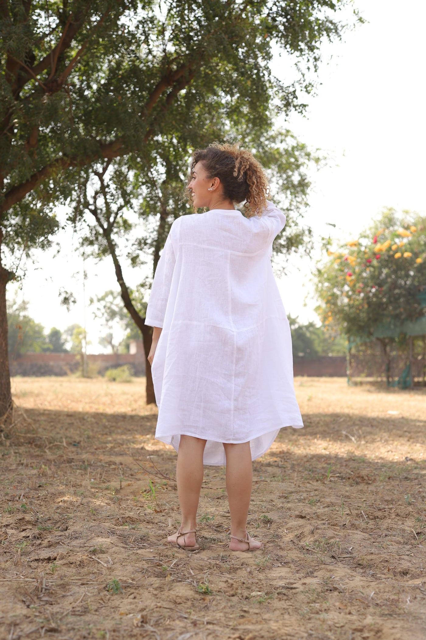 White oversized linen shirt dress in washed linen, photographed in Jaipur