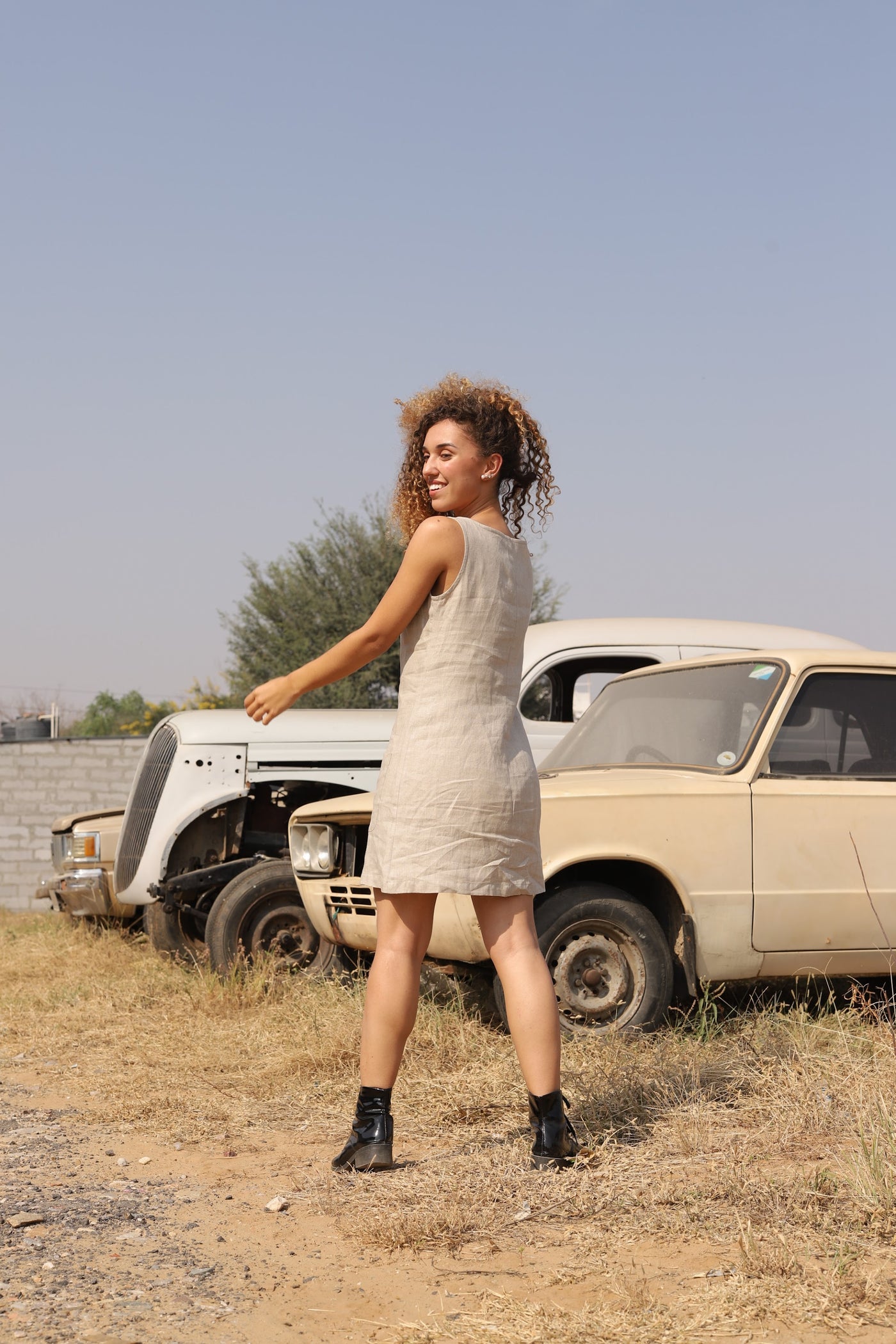 Natural sleeveless linen shift in washed linen, photographed in Jaipur