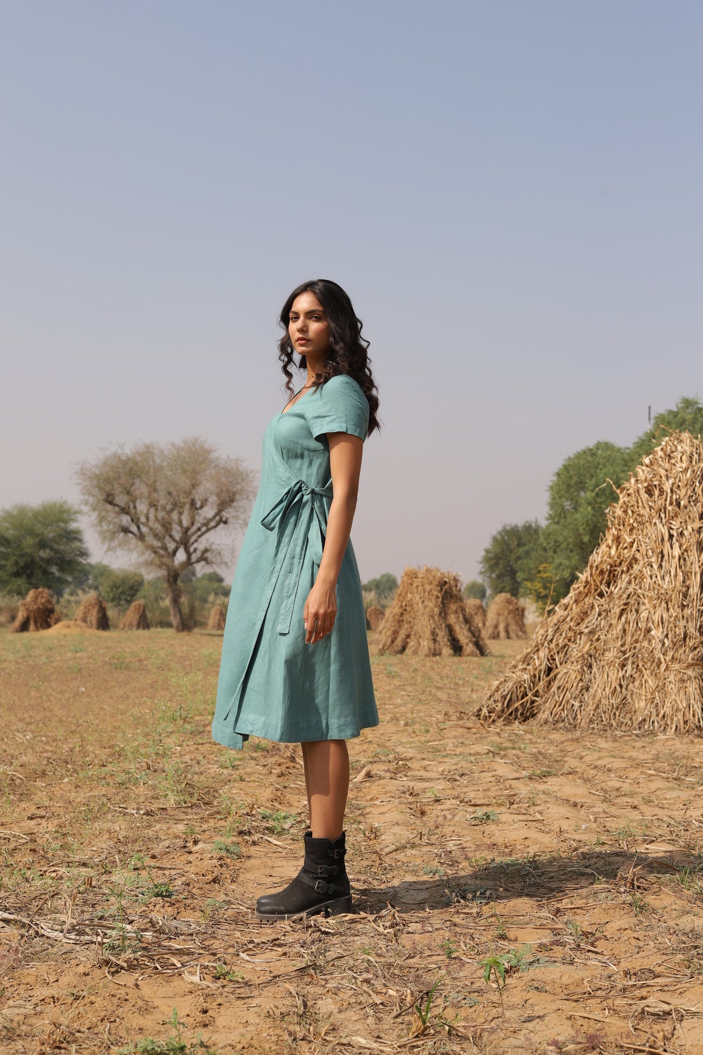 Teal wrap linen midi dress in washed linen, photographed in Jaipur