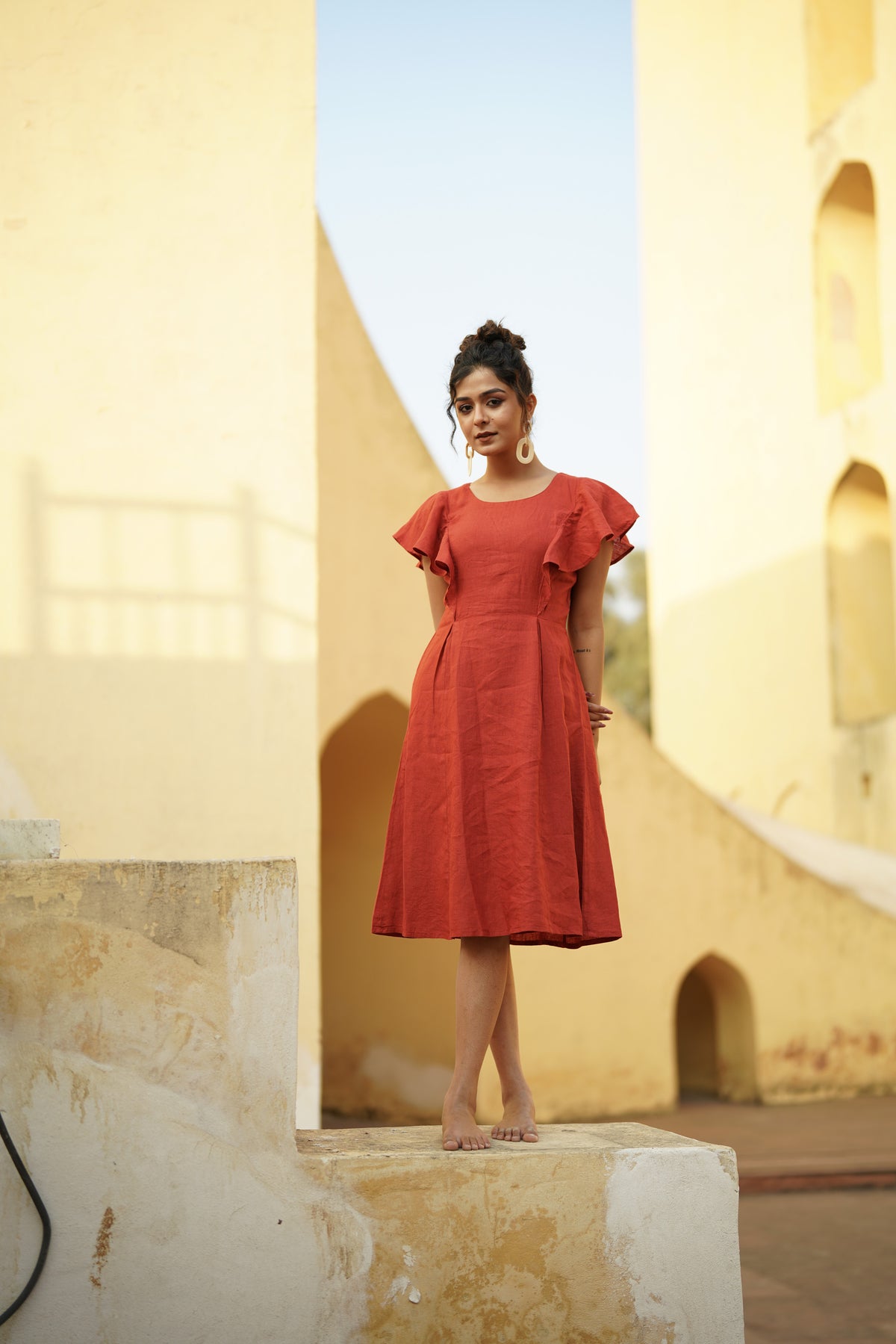 Frill Sleeve Linen Dress in rust, photographed in Jaipur