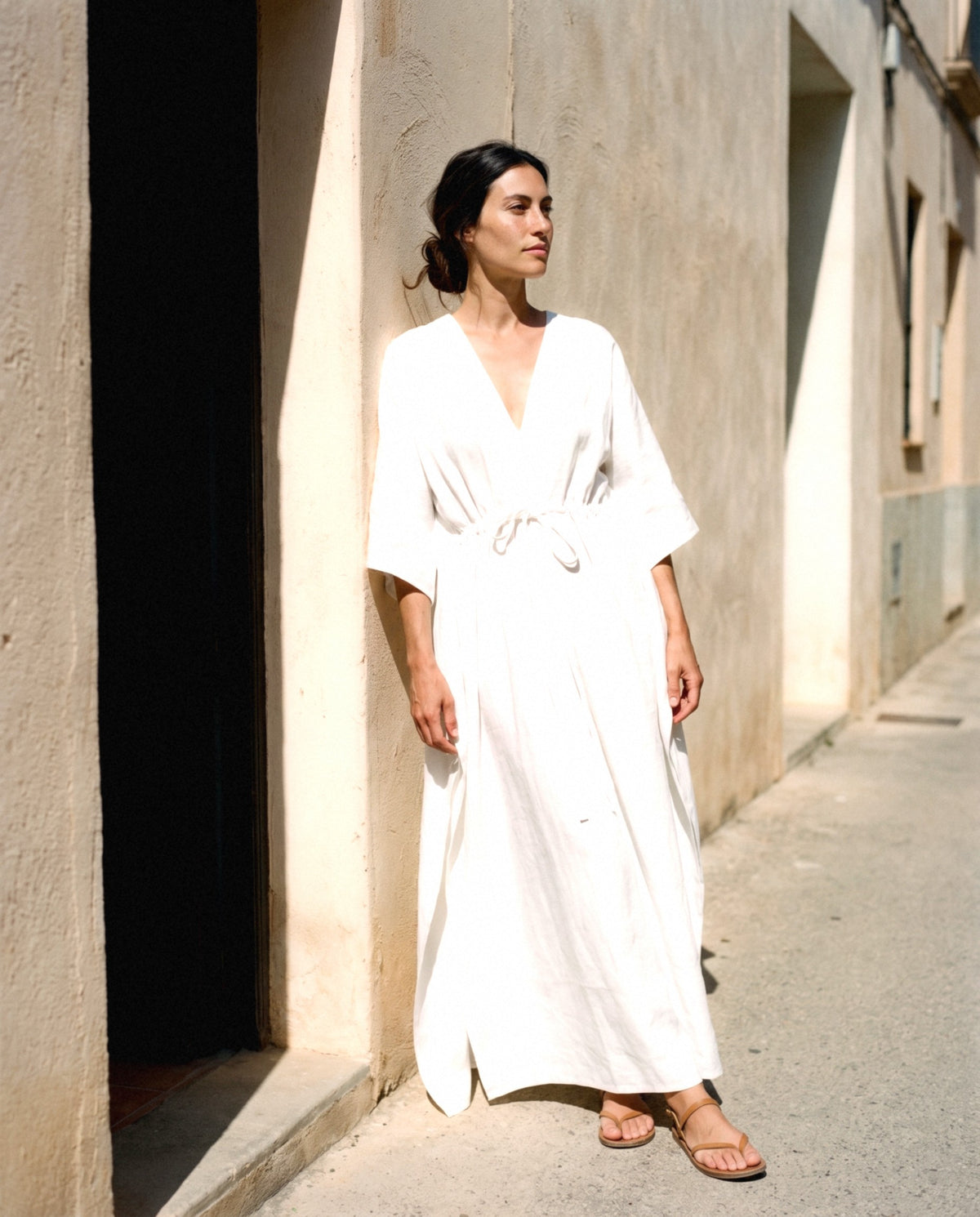 Batwing Linen Kaftan in white, worn outdoors