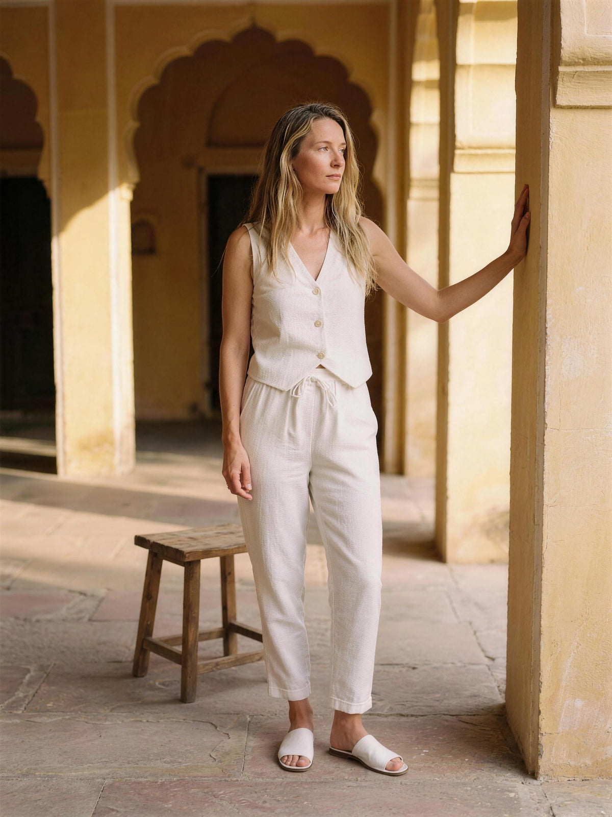 Flax linen waistcoat and tapered trousers photographed in a Jaipur haveli courtyard