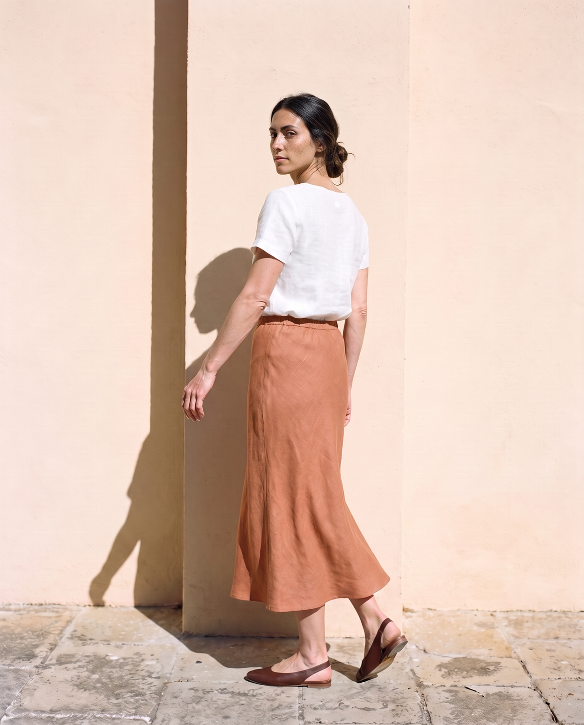 Marta Slip Skirt in clay, turning away, side and back