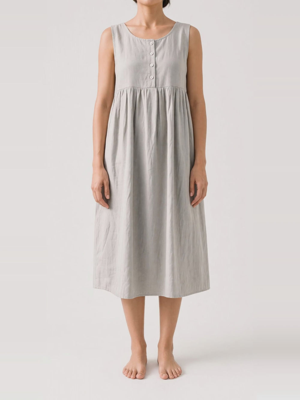 Button Front Gathered Midi in light grey, turning in the studio